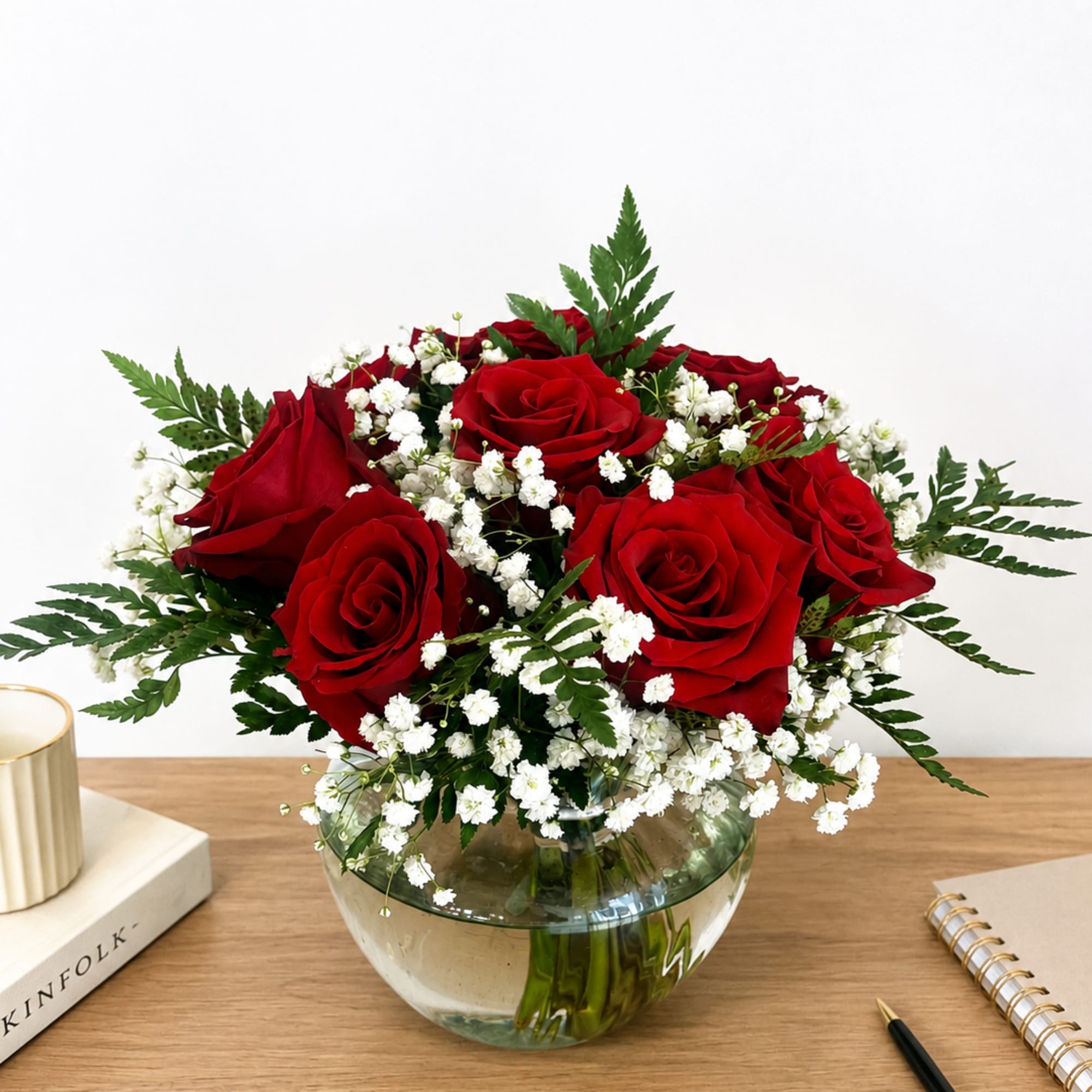 A charming vase arrangement featuring vibrant red roses, delicate baby&rsquo;s breath, and, photo 3 of 3