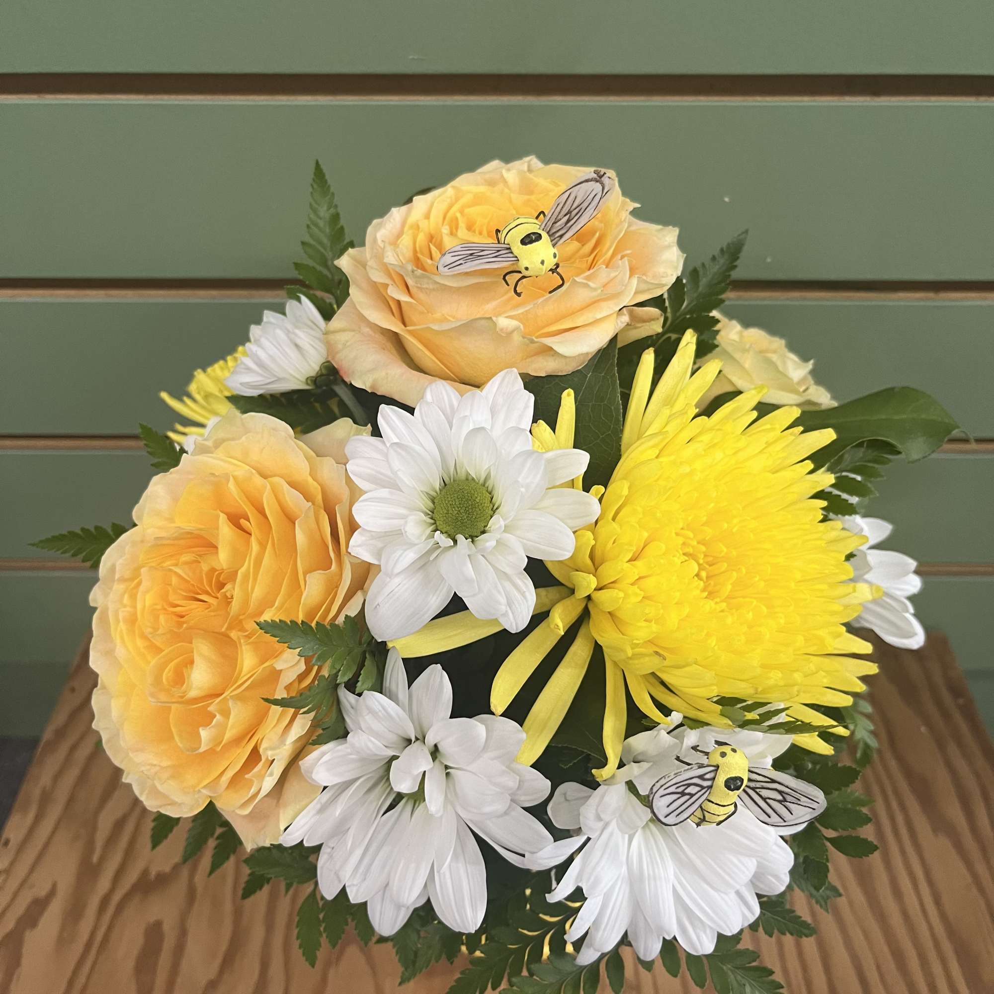 Sunlit yellow roses and bright yellow chrysanthemums mingle with crisp white daisies, photo 2 of 2