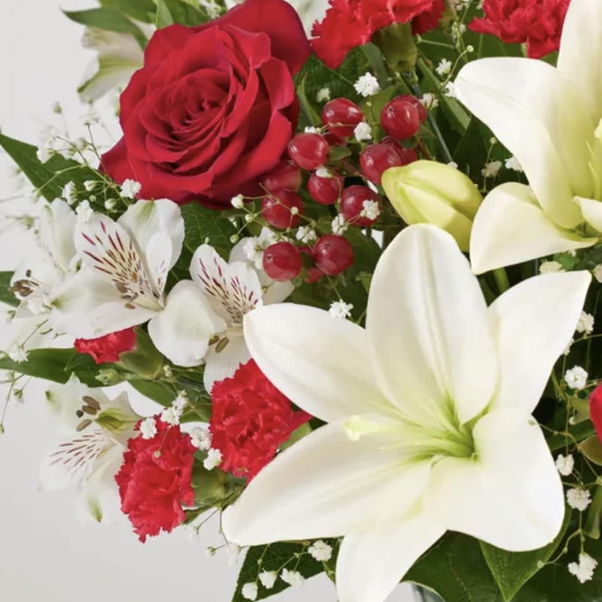 Bouquet with red roses, white lilies, and red carnations
