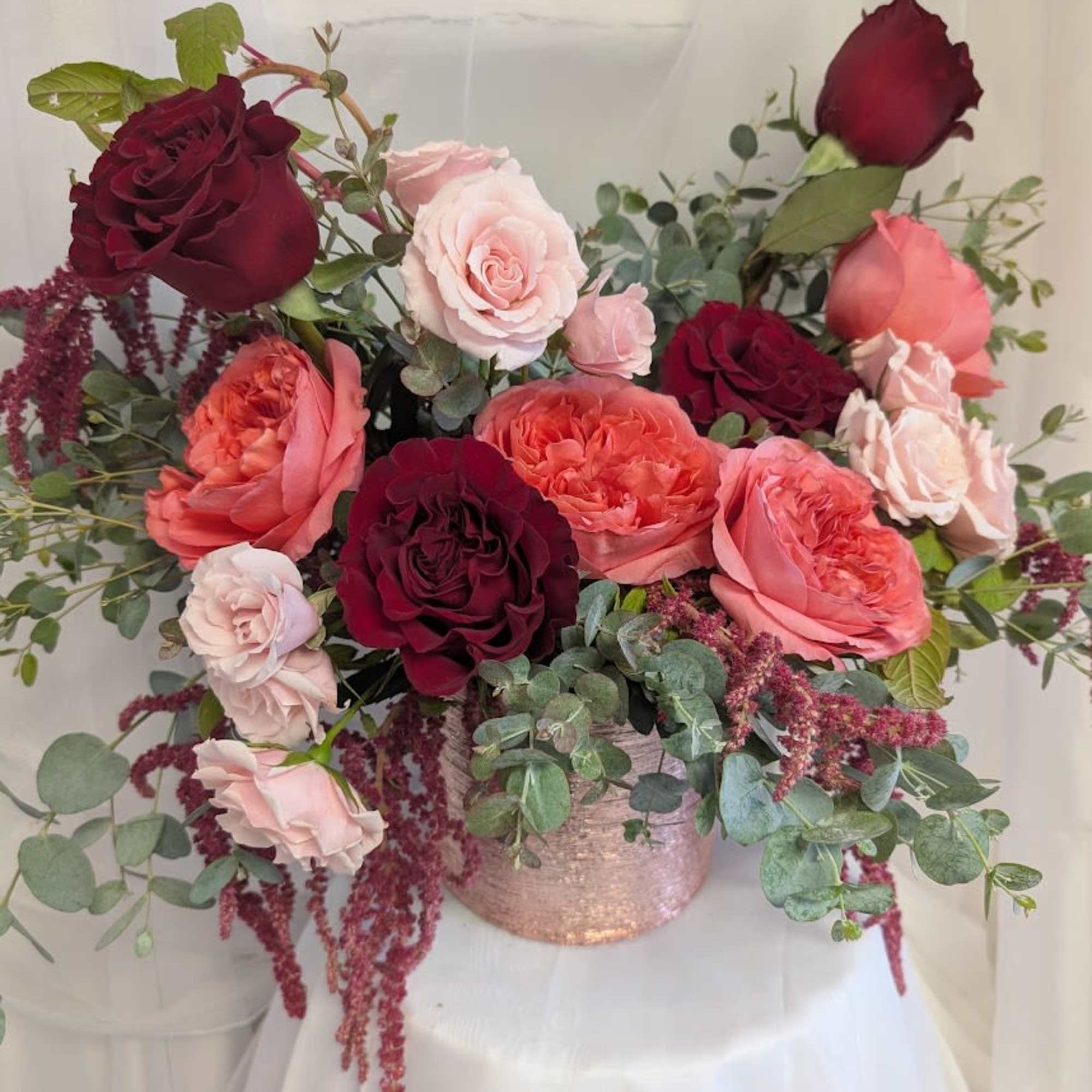 A modern one-sided arrangement with a combination of Garden Roses, Spray Roses, photo 2 of 3