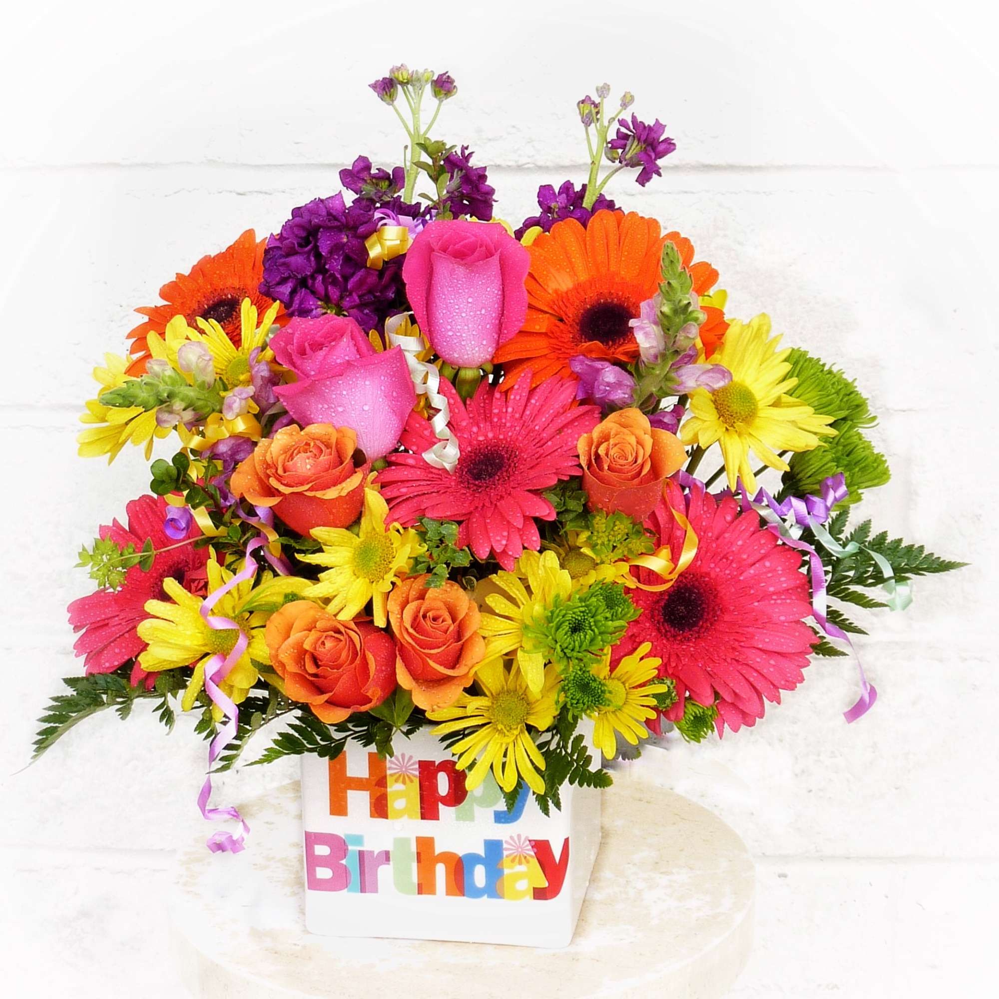 Bright mixed bouquet in a Happy Birthday container