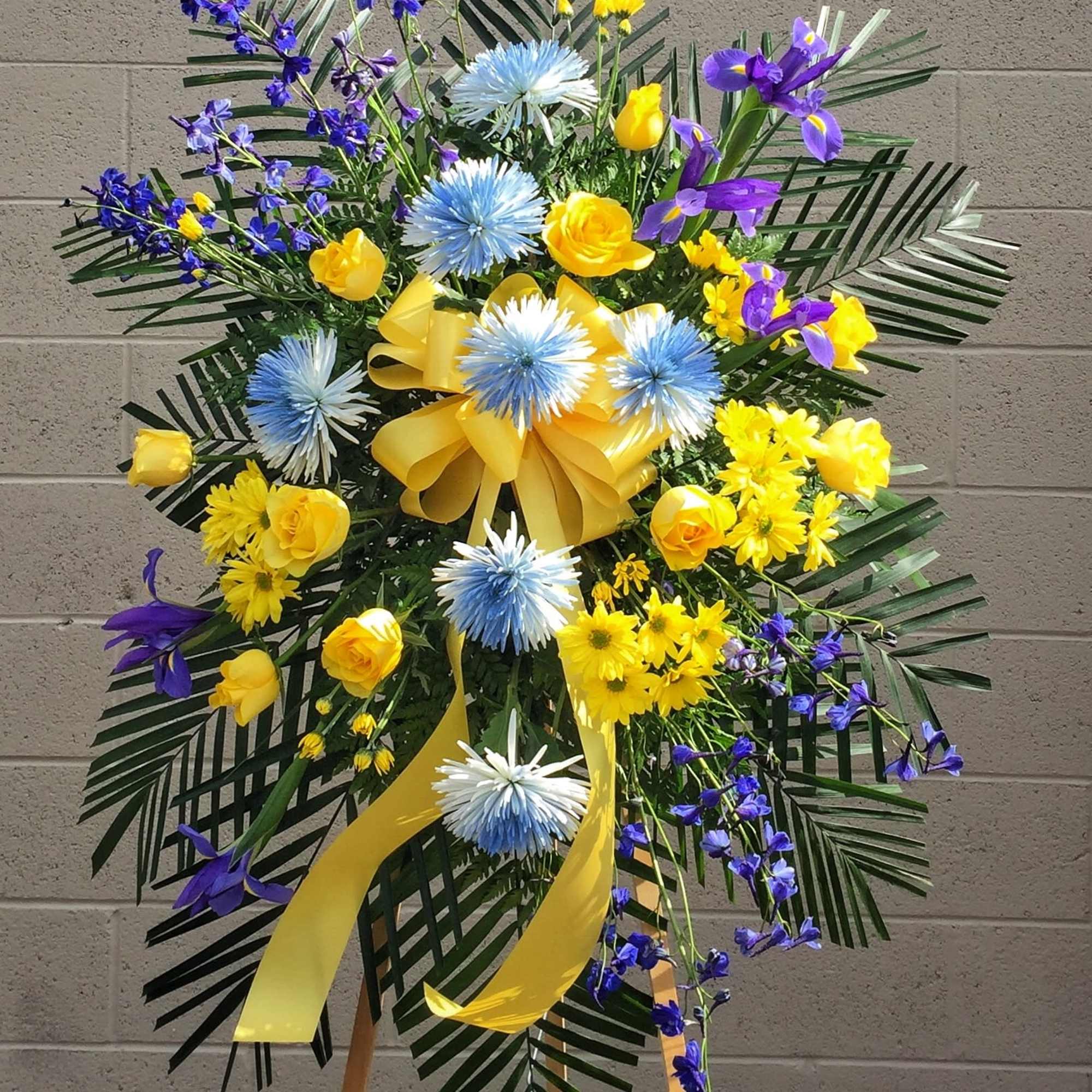 Funeral spray with yellow and blue fresh flowers
STANDARD: FIRST PHOTO
DELUXE: SECOND PHOTO
