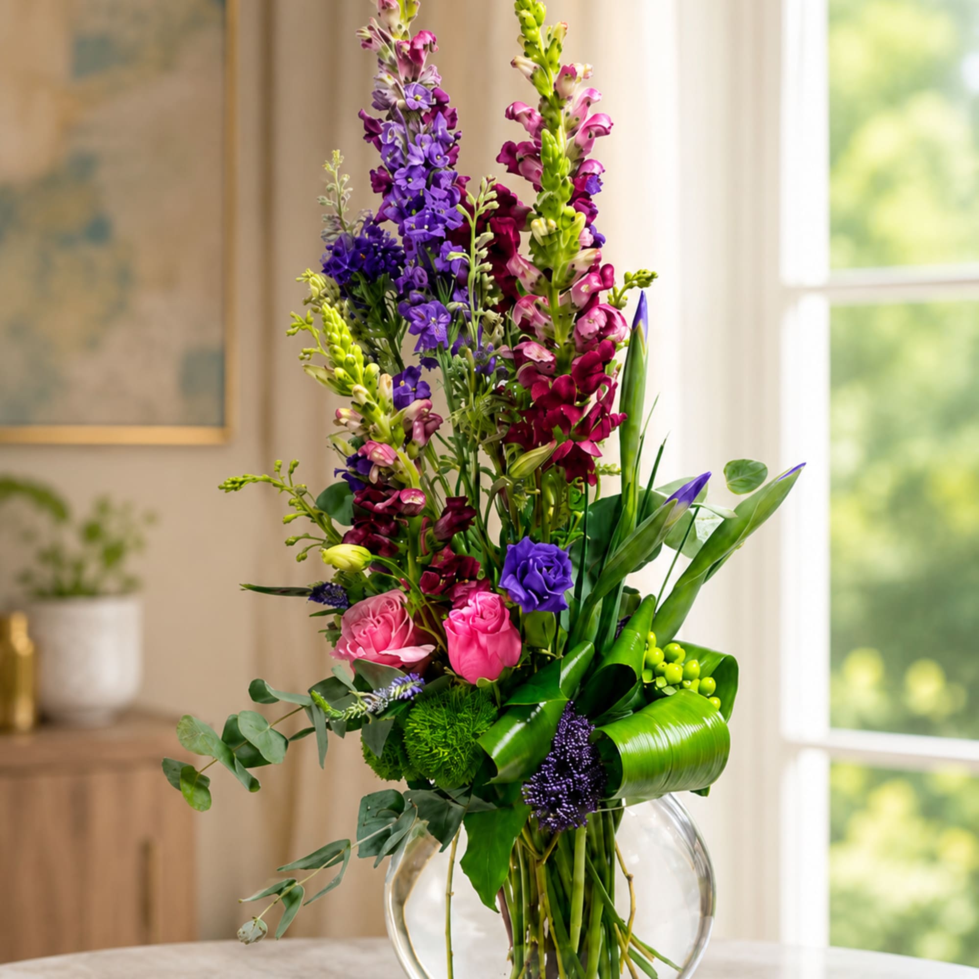 Tall spires of purple and magenta snapdragons reach upward in this vibrant