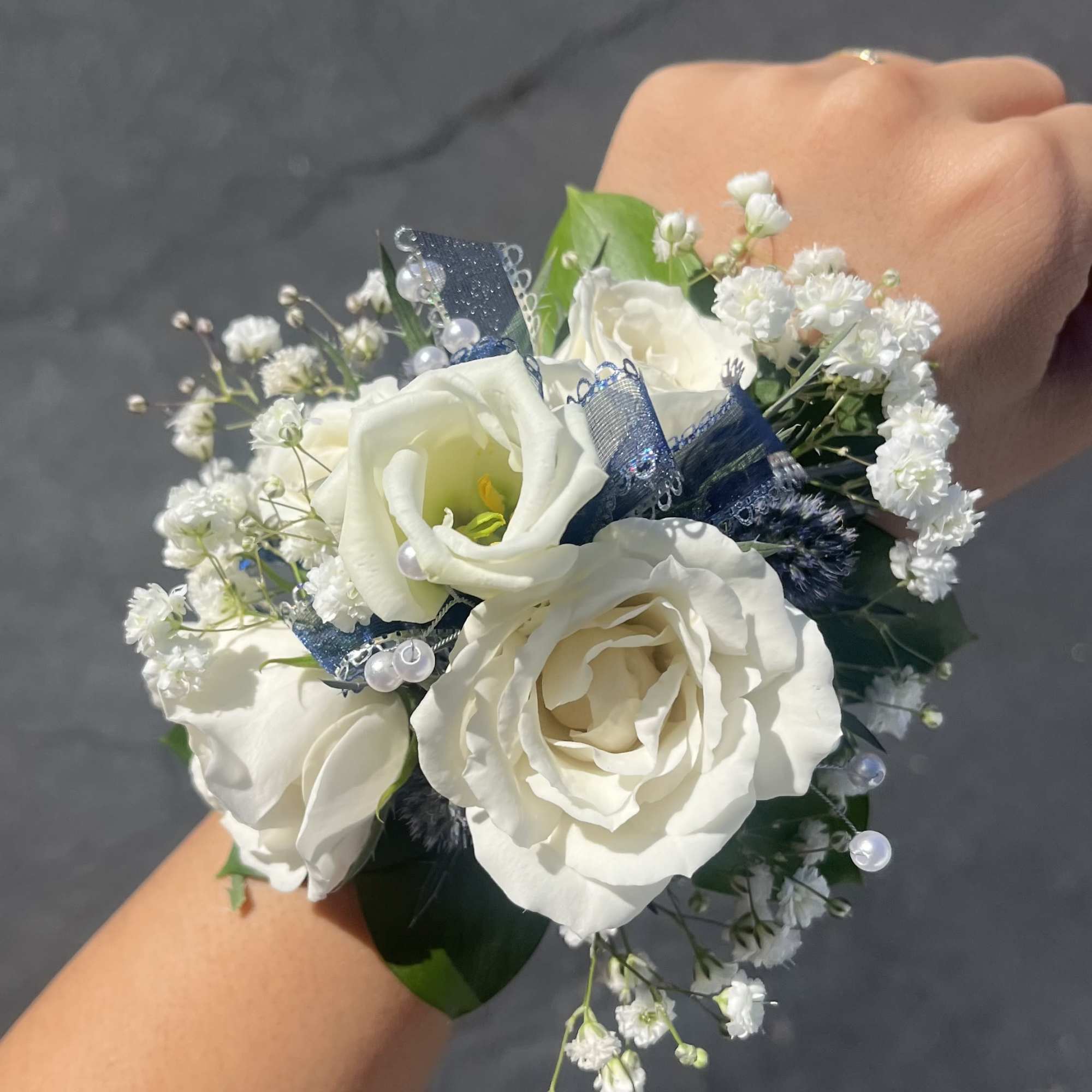 Wrist Corsage.  Photo is just a sample.  Actual flowers uses