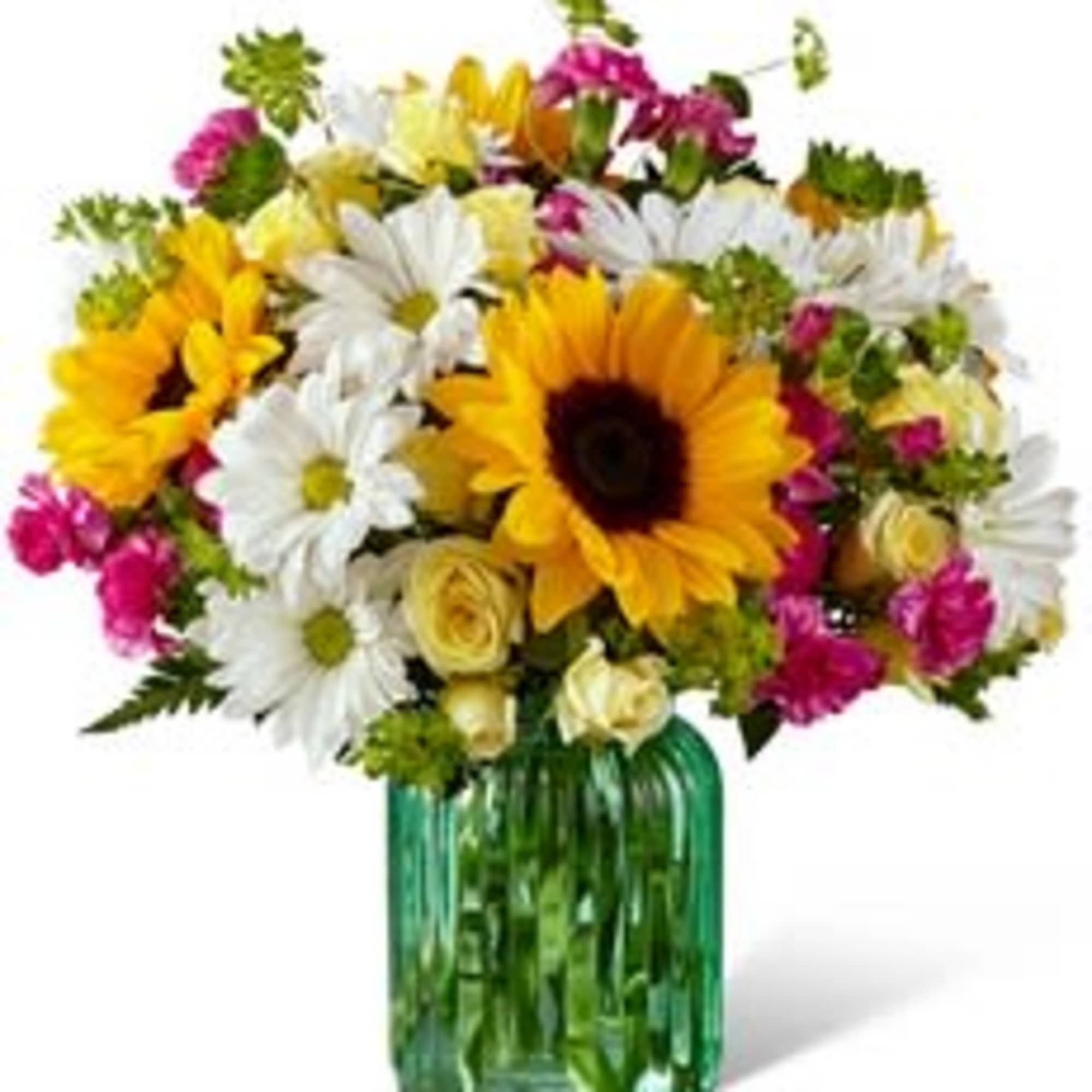 Mixed bouquet with sunflowers, white daisies, and pink flowers in a green glass vase