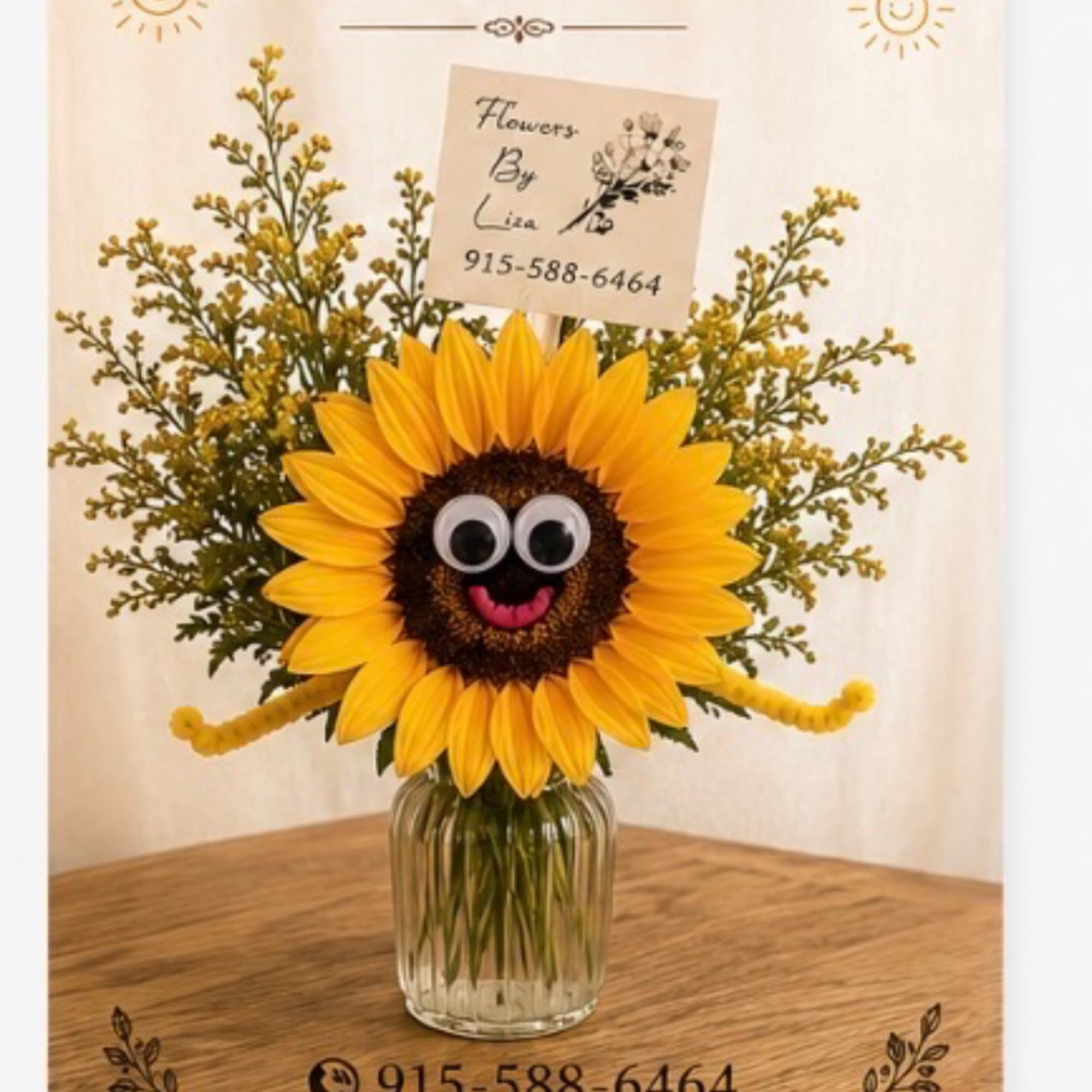 Sunflower arrangement in a glass vase with a playful face decoration