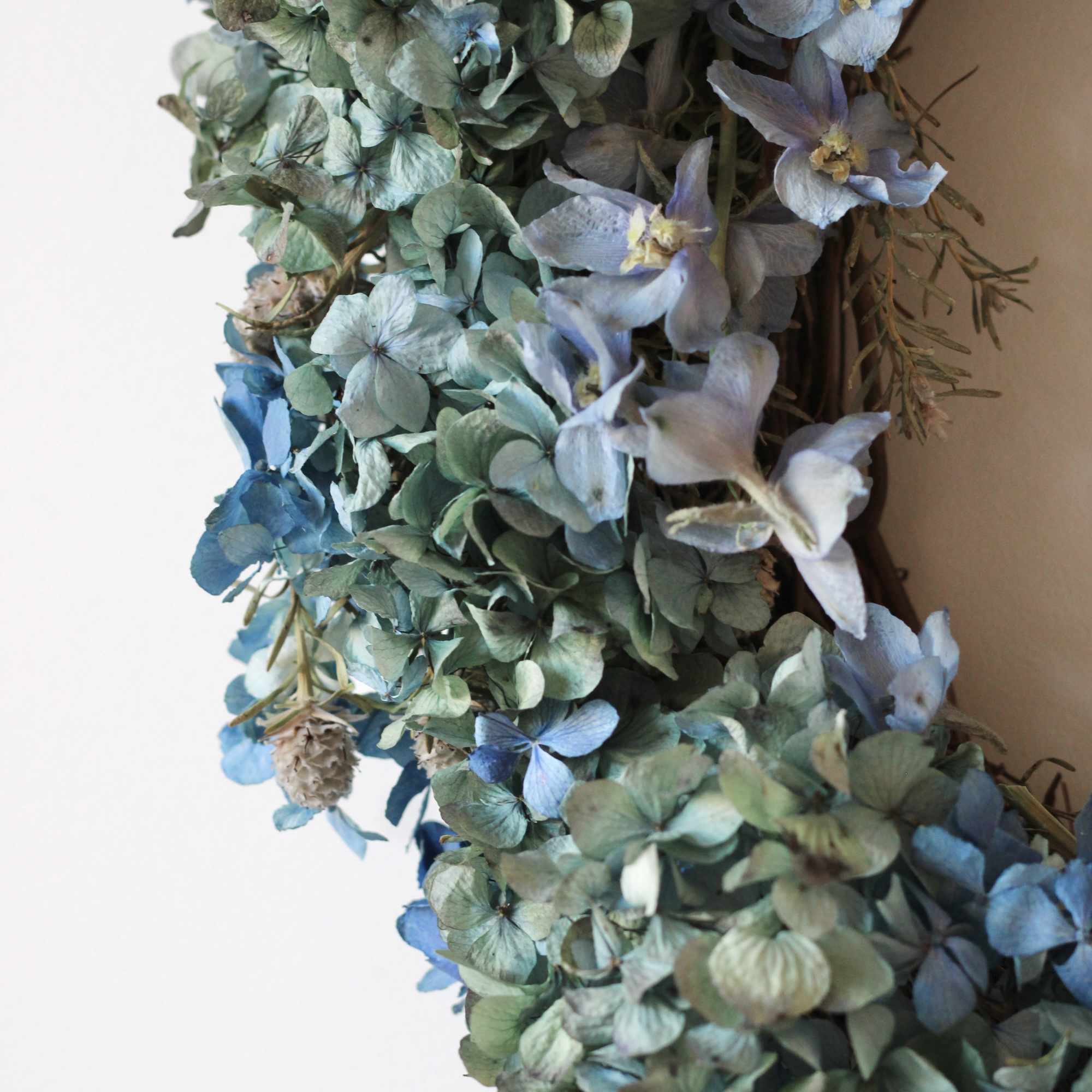 Blue and green hydrangea wreath with small blue flowers