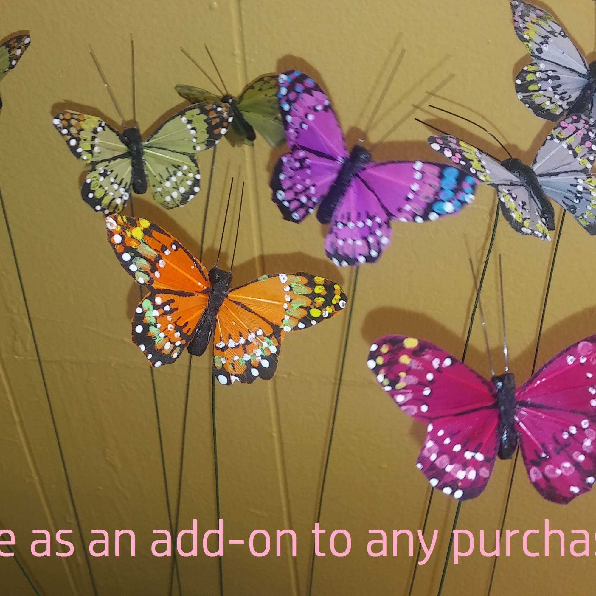 Decorative butterfly picks in bright colors on thin stems