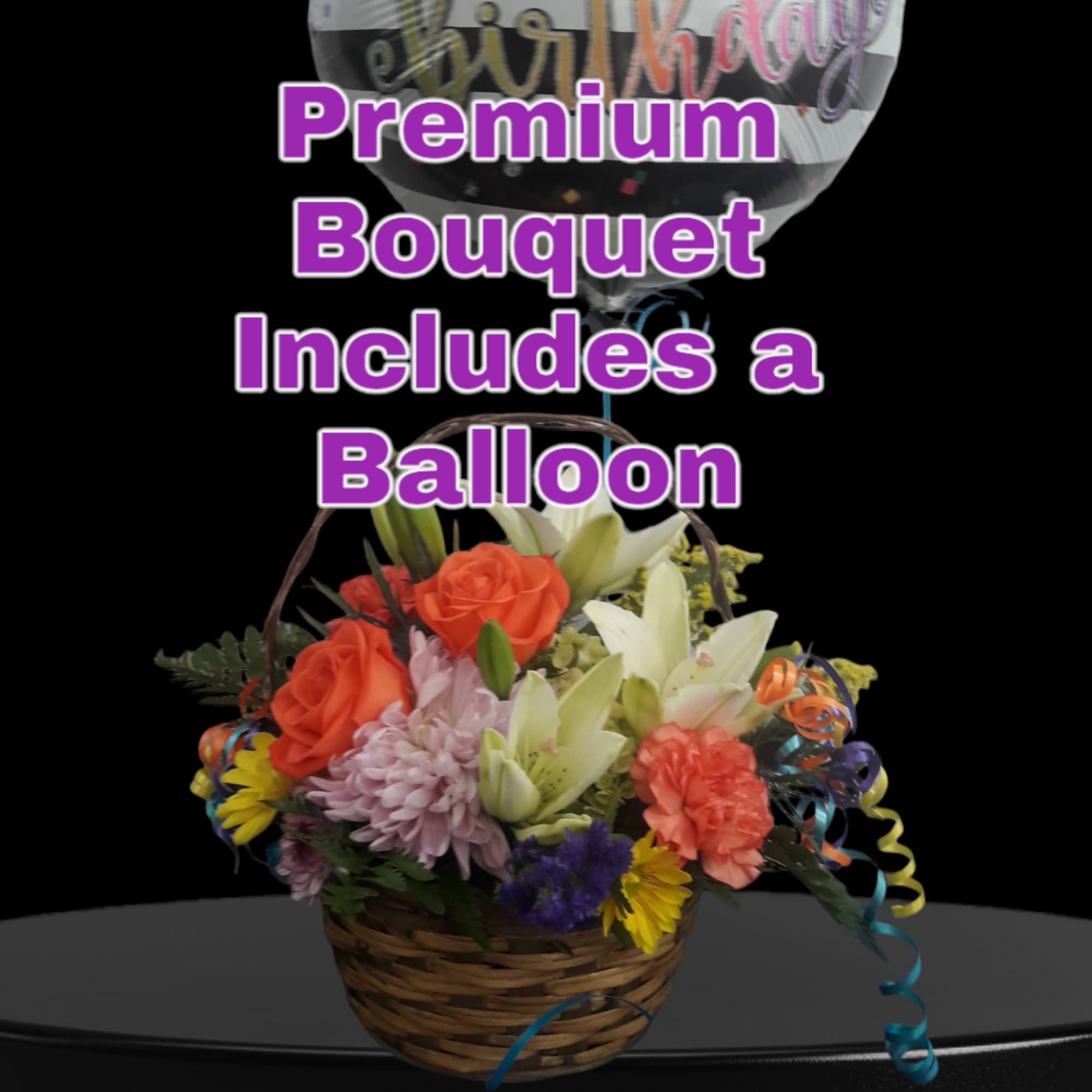 Basket bouquet of mixed flowers with a balloon above it