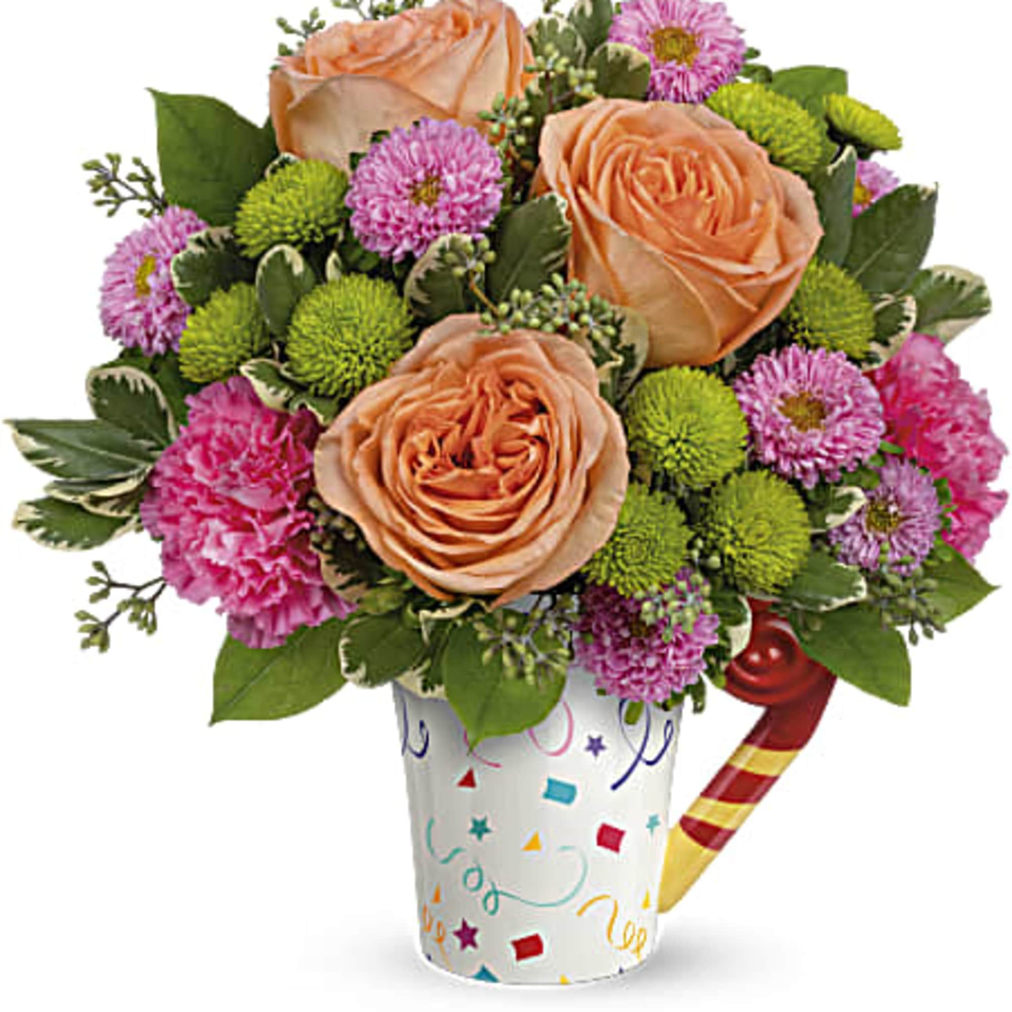 Peach roses and pink flowers in a confetti-patterned cup with a candy cane pick