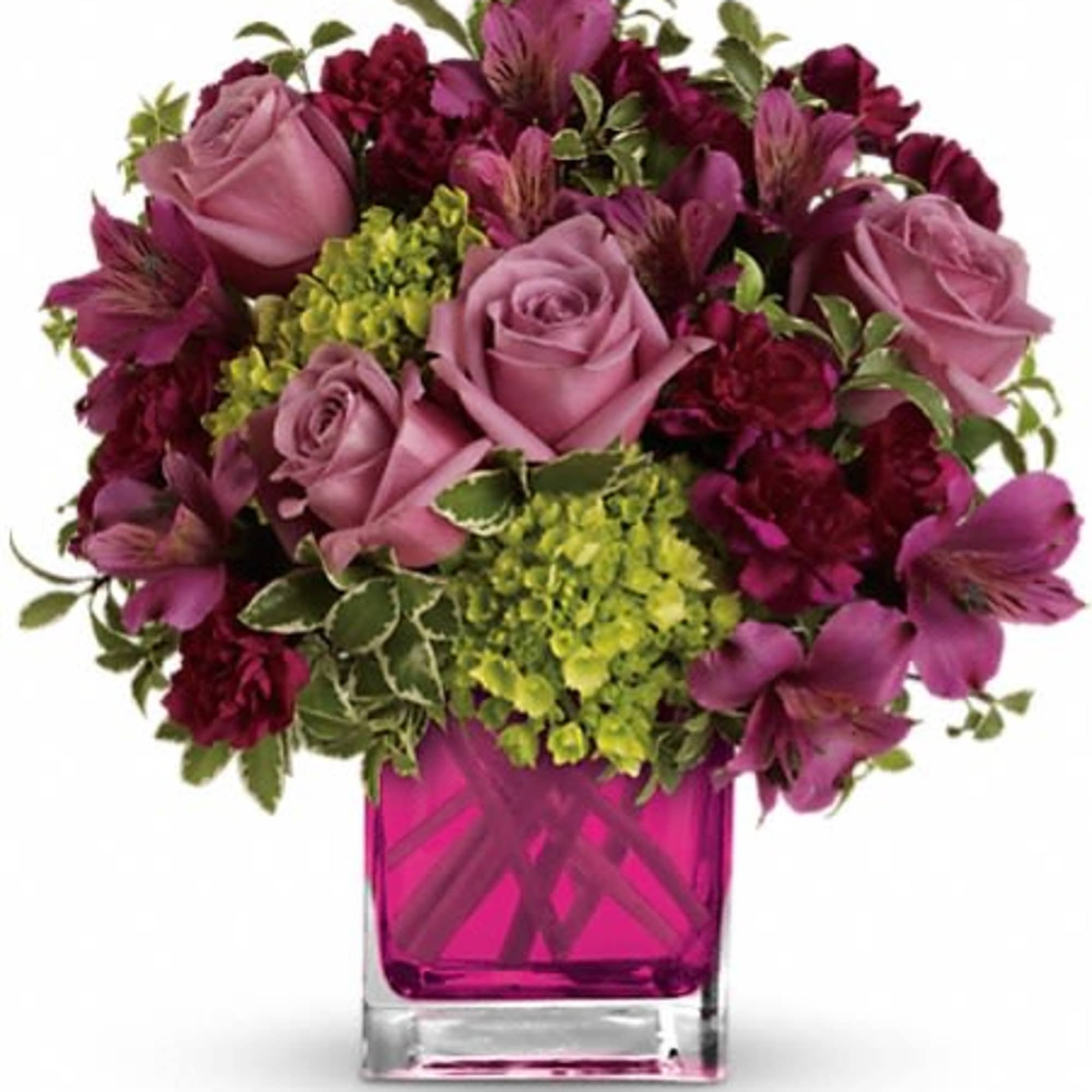 Pink and purple bouquet of roses and alstroemeria in a magenta glass vase