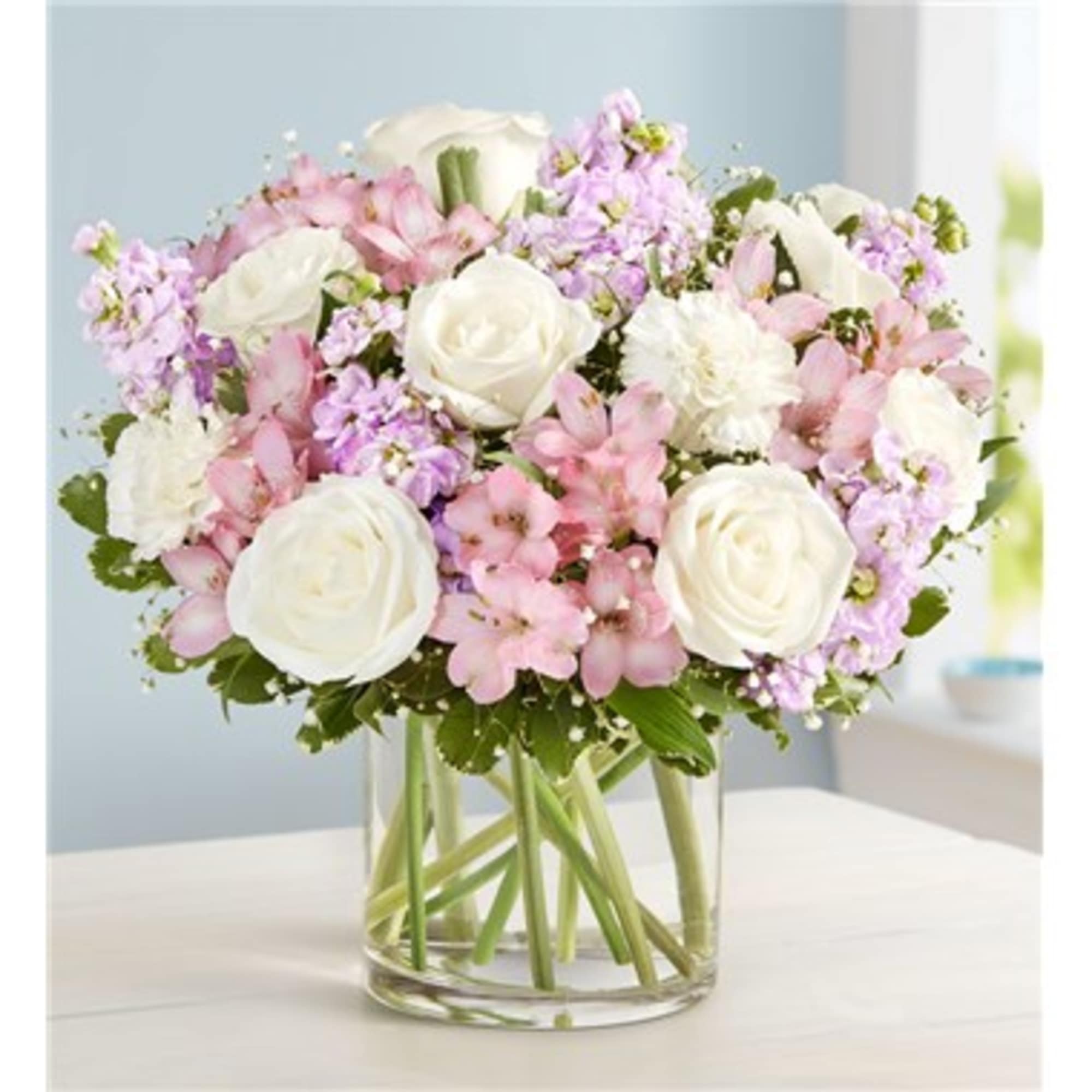 Pink and white mixed bouquet in a clear glass vase