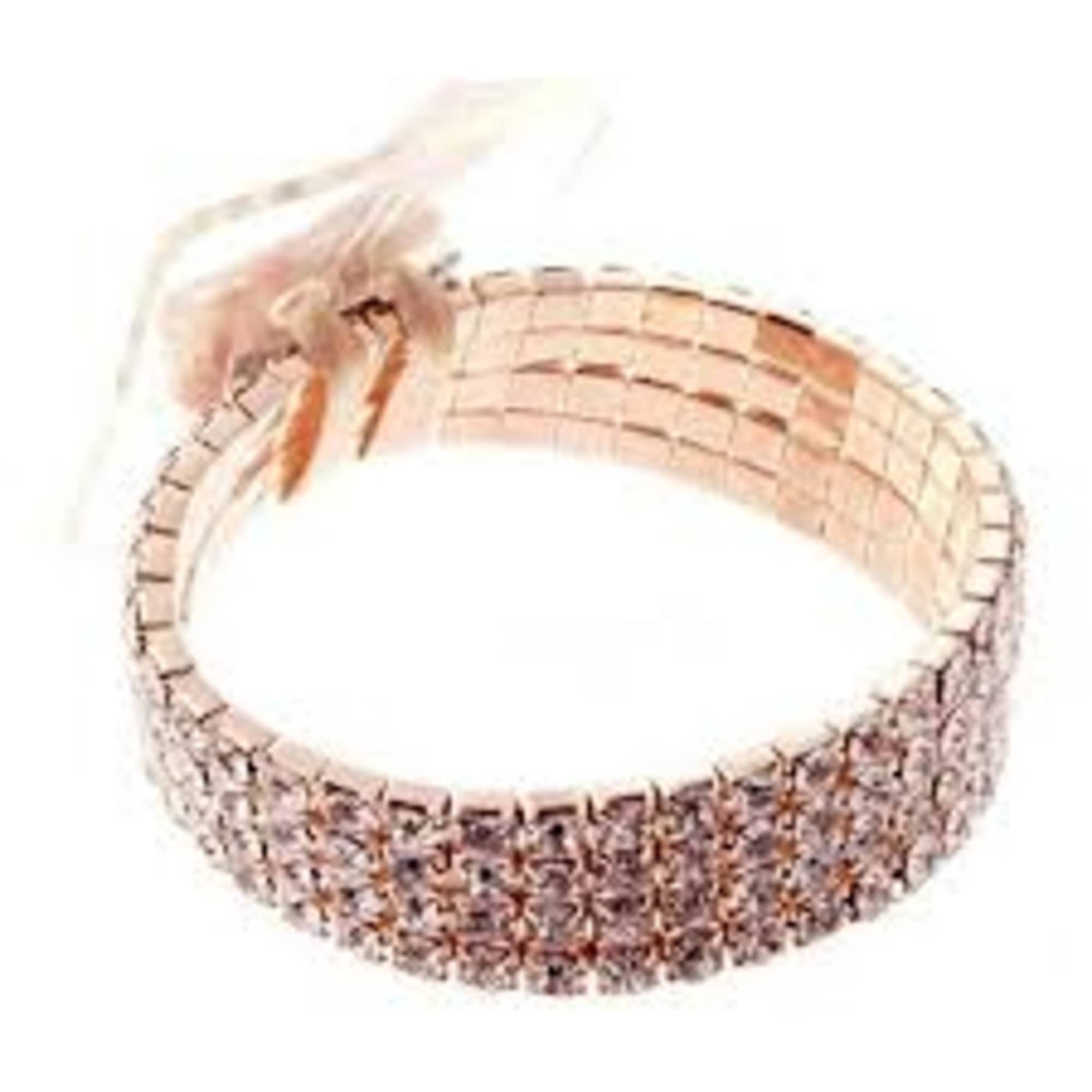 Pink woven bracelet with a tassel tie