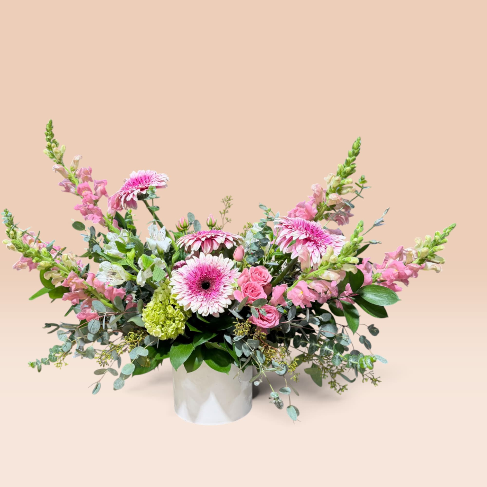 Pink and white mixed flower arrangement in a white vase, photo 4 of 7