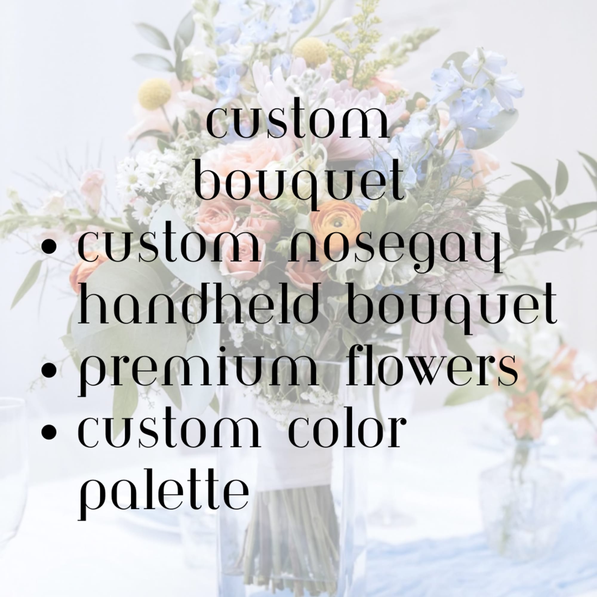 Pastel bouquet with blue, pink, and white flowers in a clear vase