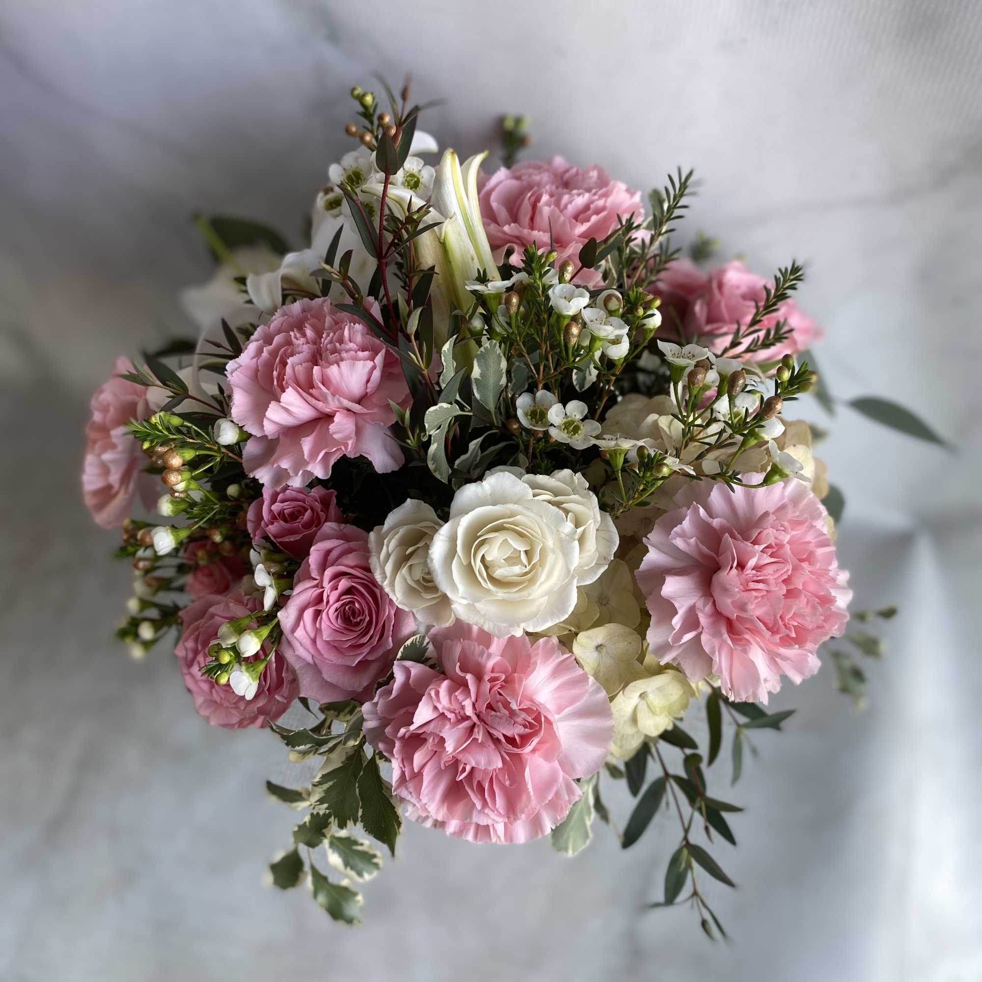 Pink and white bouquet with roses and carnations