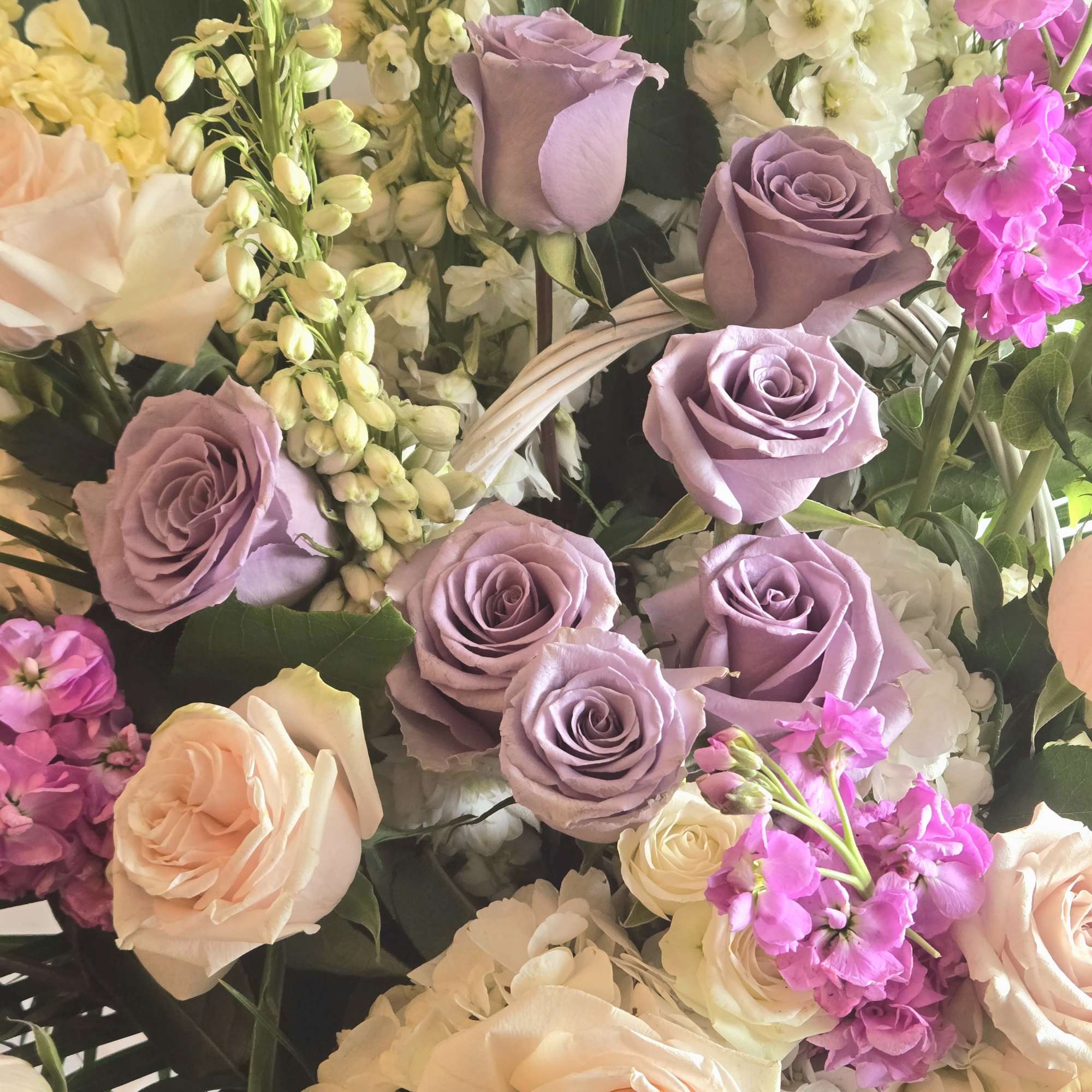 Soothing pastel hues in purple and pink make up this delicate arrangement., photo 2 of 2