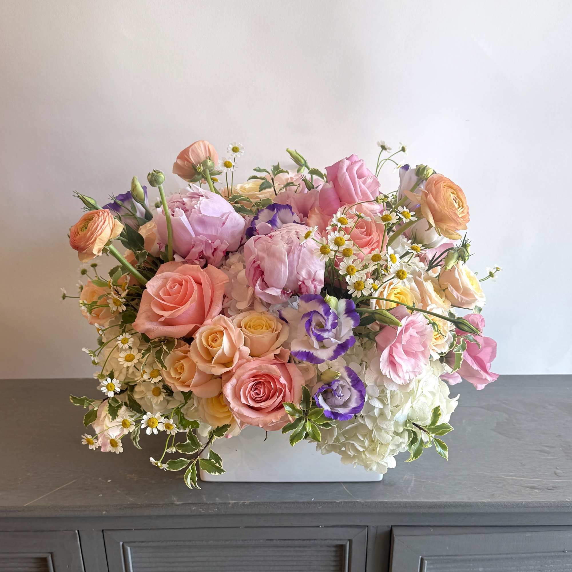 Soft garden charm makes this arrangement the perfect gift to surprise your