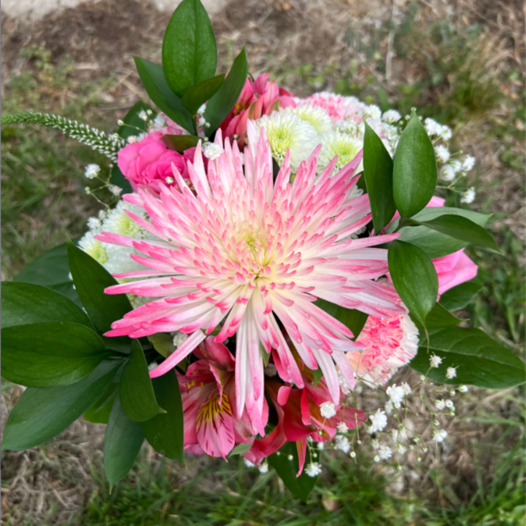 An elegant hand-tied bouquet that will compliment any prom outfit. Filled with
