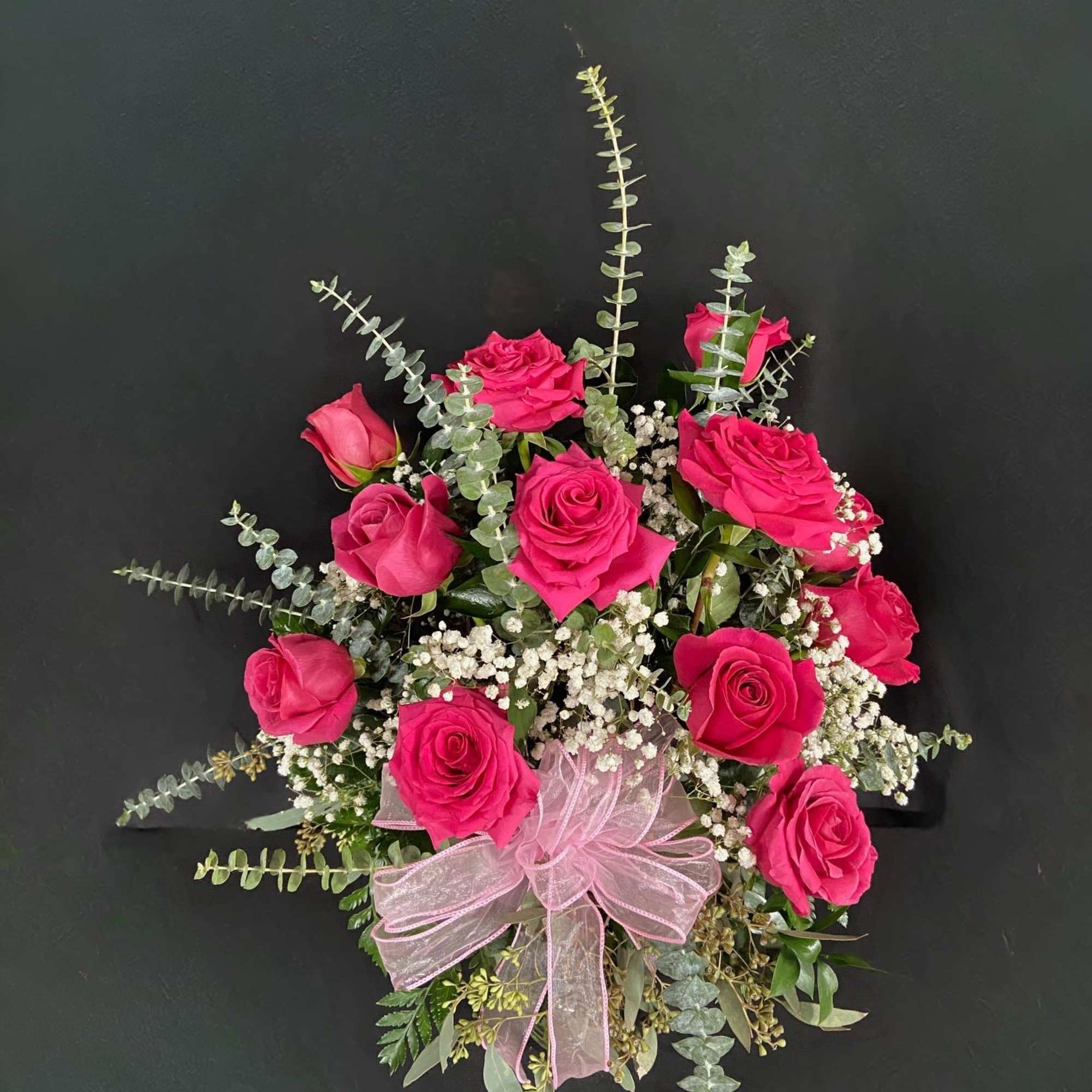Pink rose bouquet with baby's breath and a pink ribbon bow