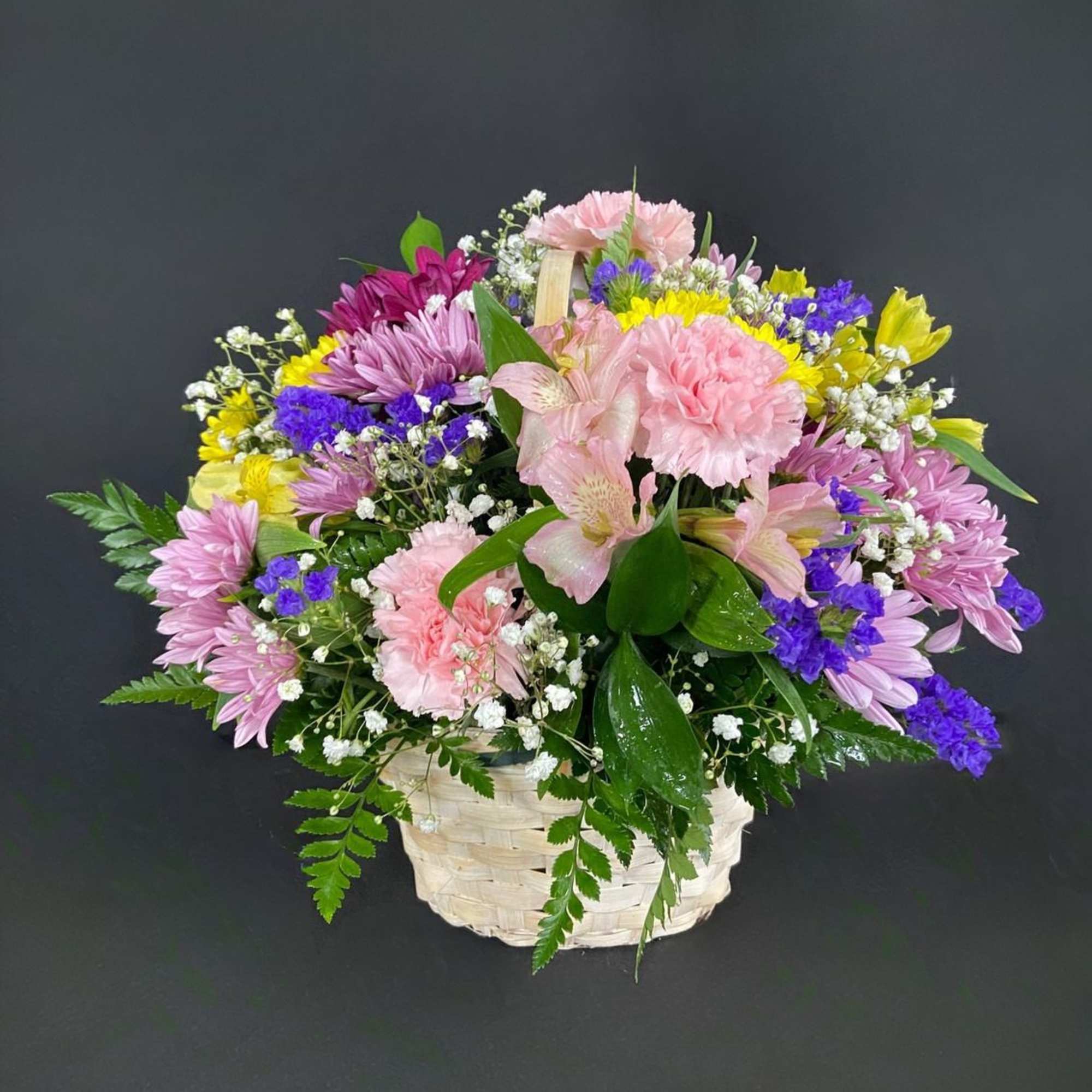 A basket of bright, colorful flowers to pick up anyone's spirits. Includes, photo 3 of 3