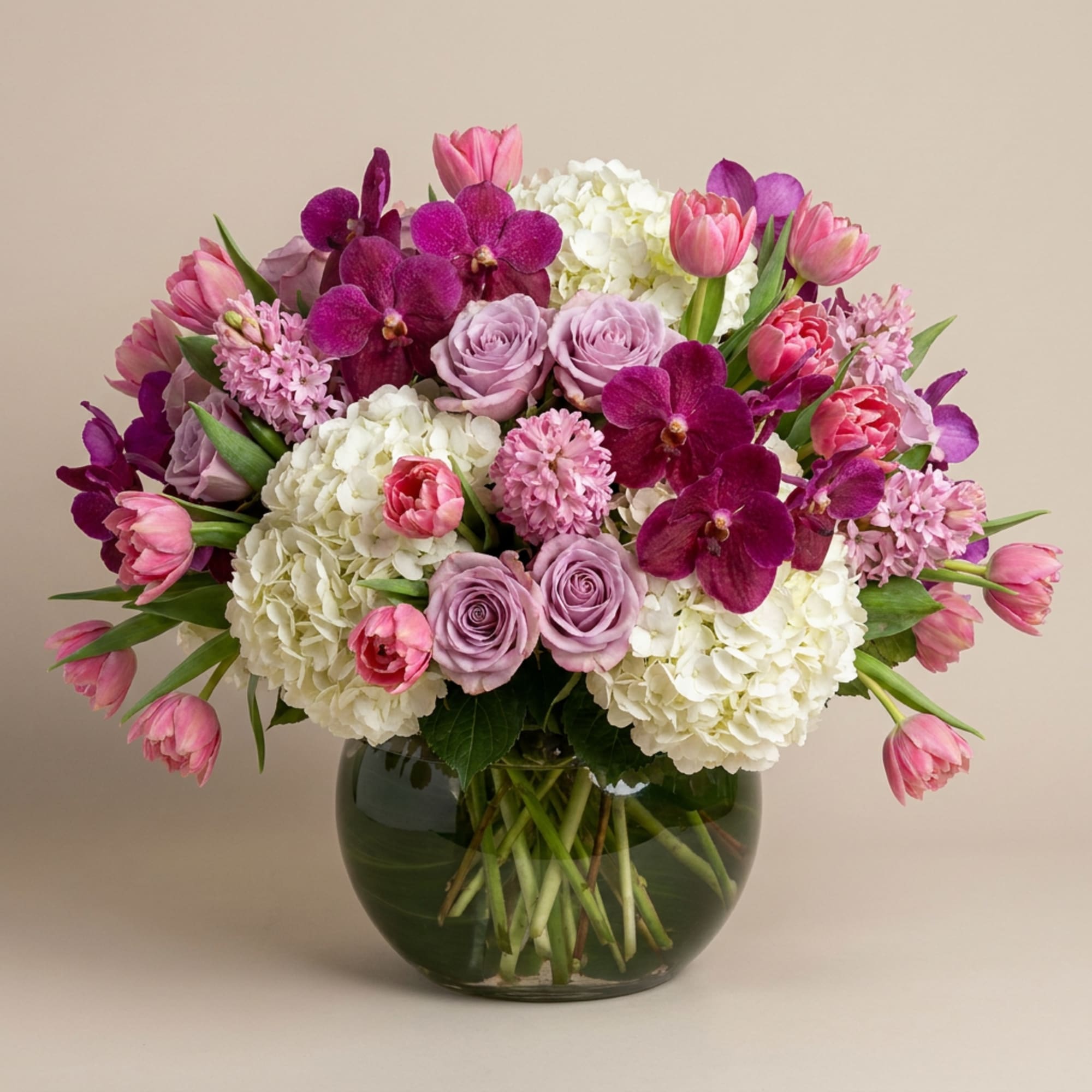 Pink and purple mixed bouquet in a glass vase