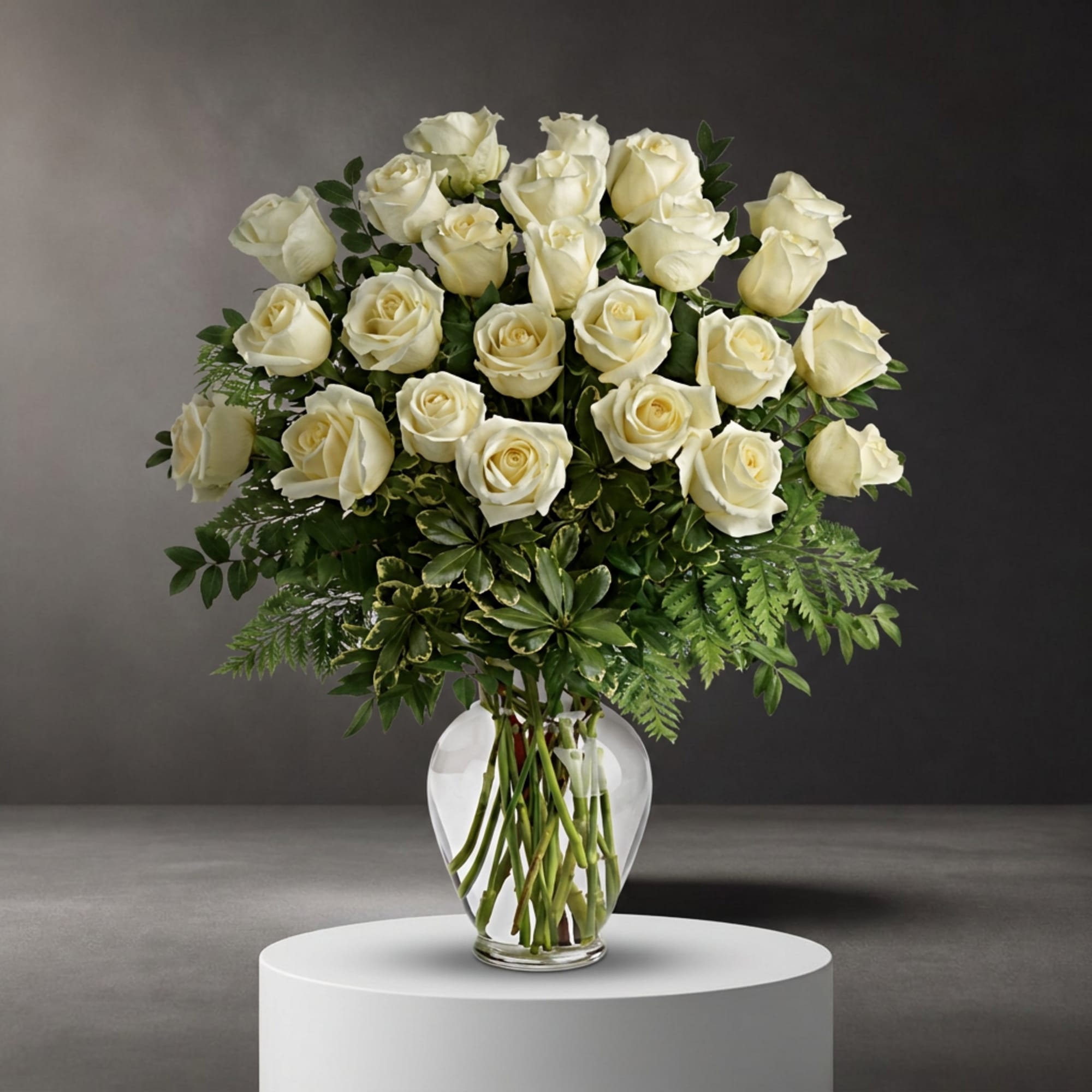Bouquet of white roses in a clear glass vase
