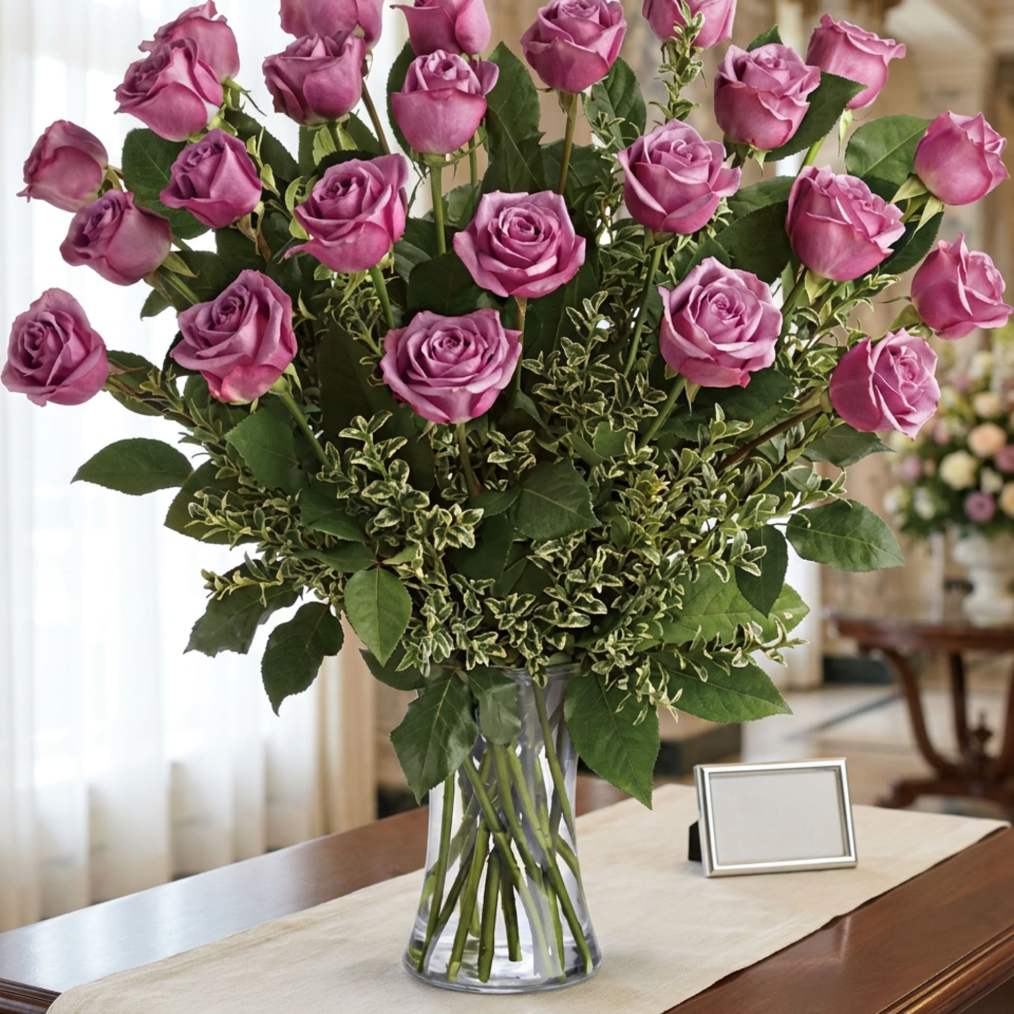 Bouquet of pink roses in a clear glass vase