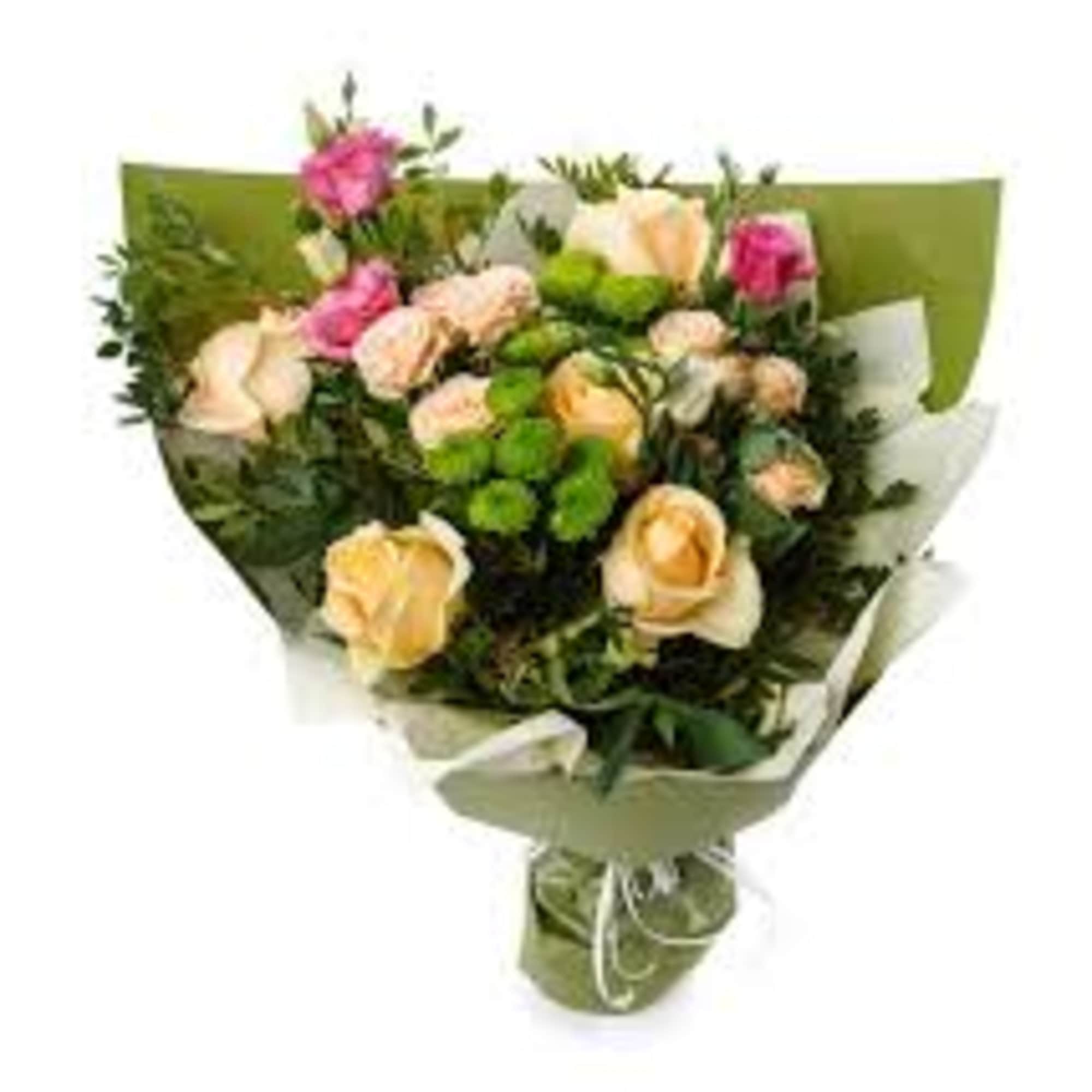 Bouquet of pink and peach roses wrapped in green paper