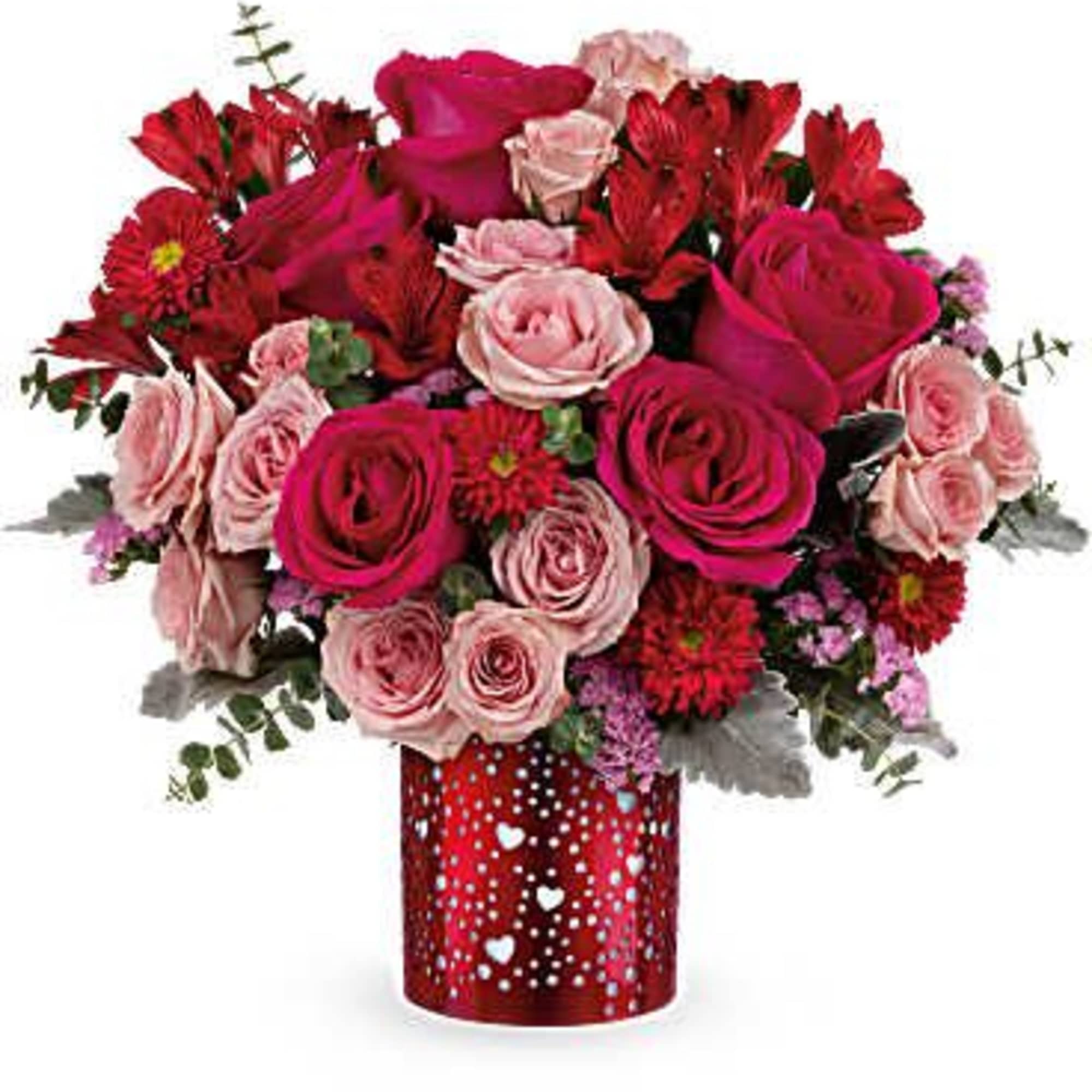 Red and pink rose bouquet in a red heart-patterned vase
