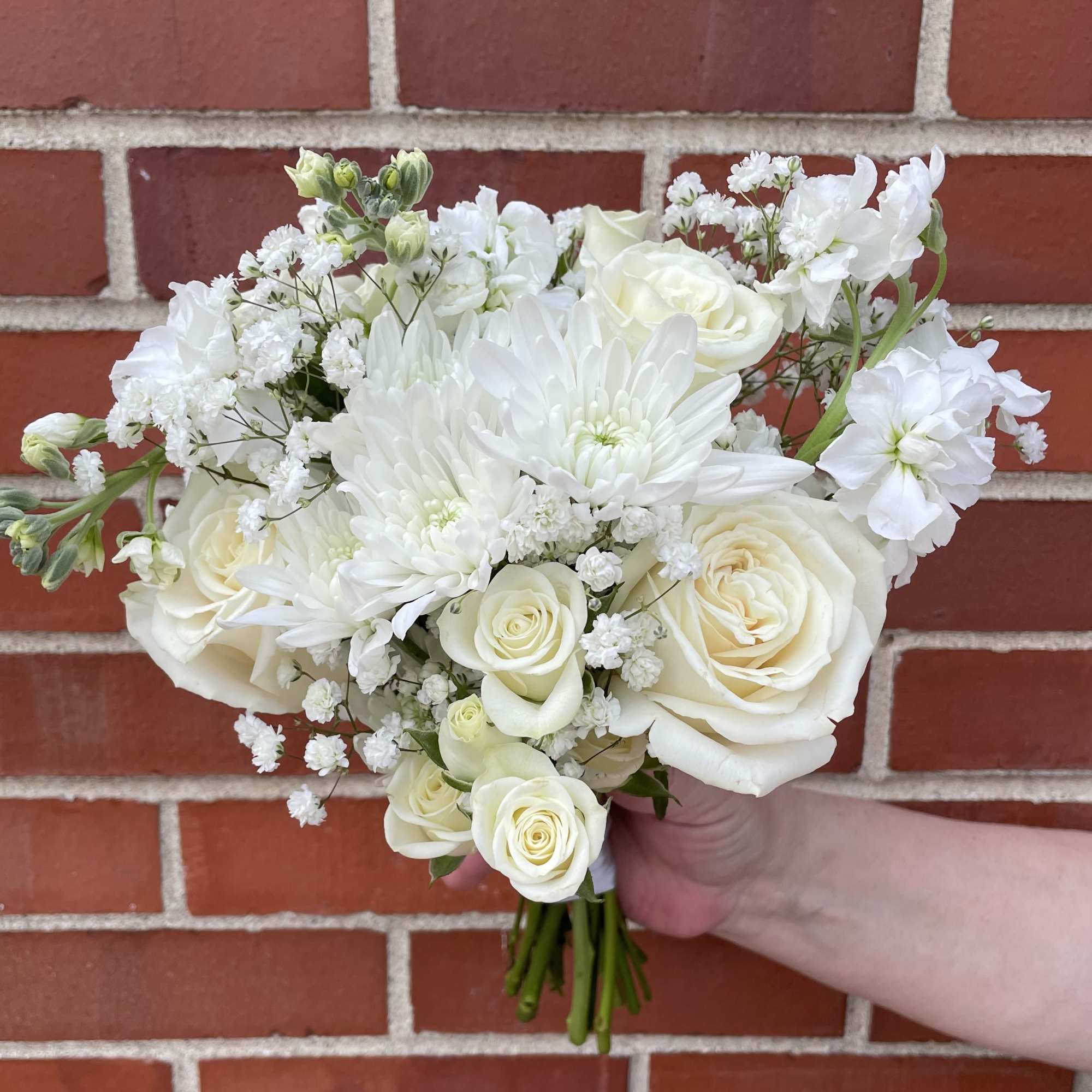 A petite hand tied bouquet designed in your color palette of choice