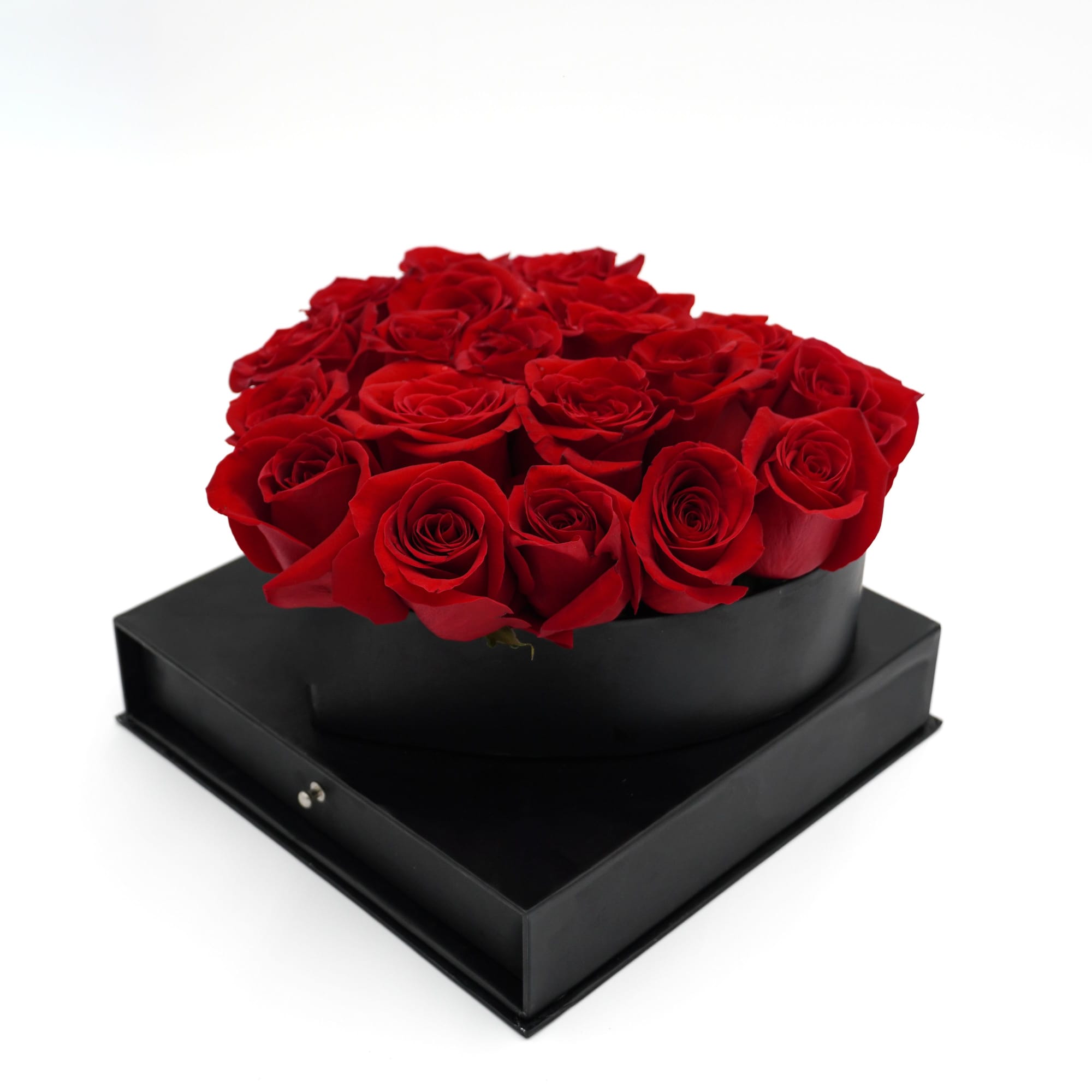 Red roses arranged in a black heart-shaped box