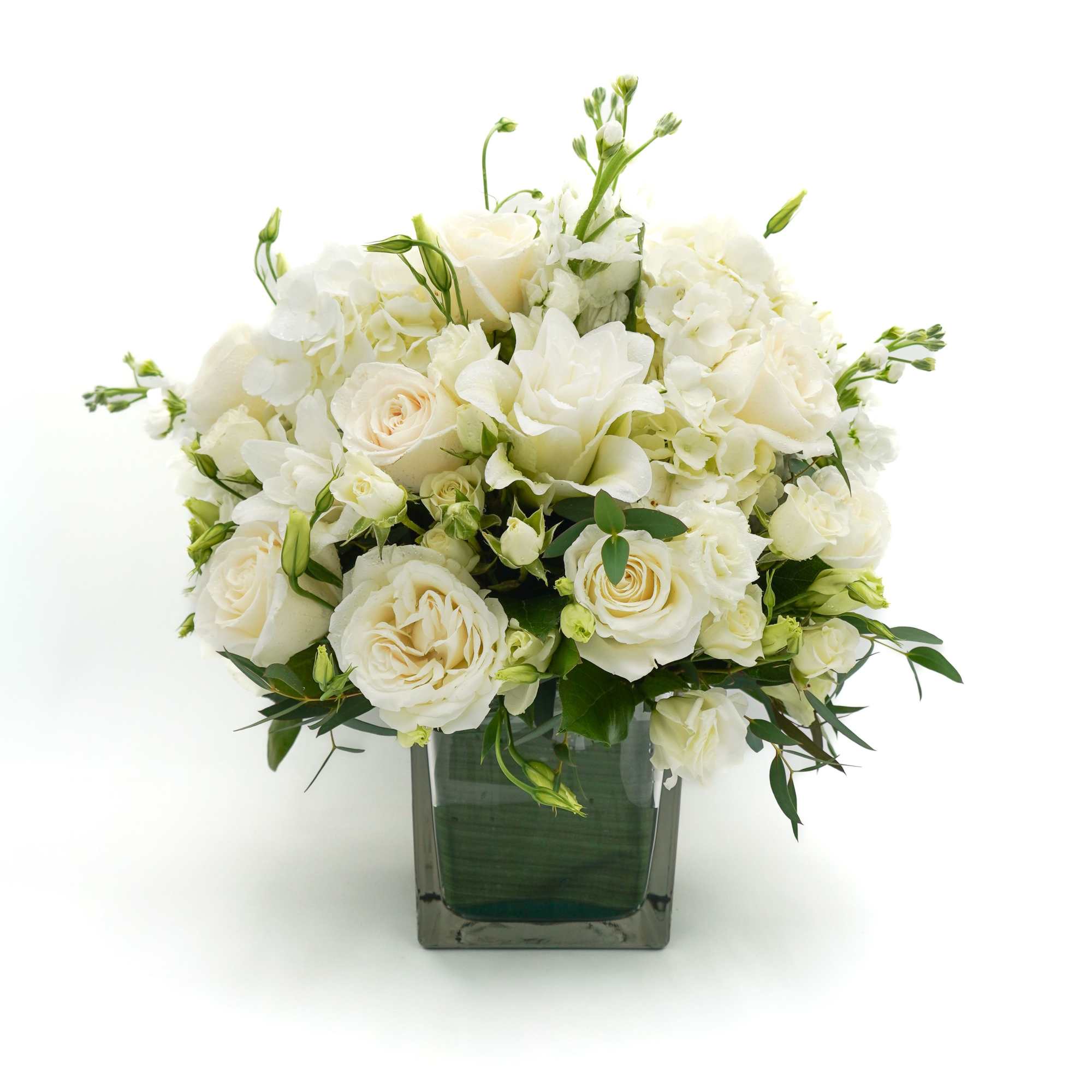 6x6 glass cube vase with white lilies, white roses, white Stock and