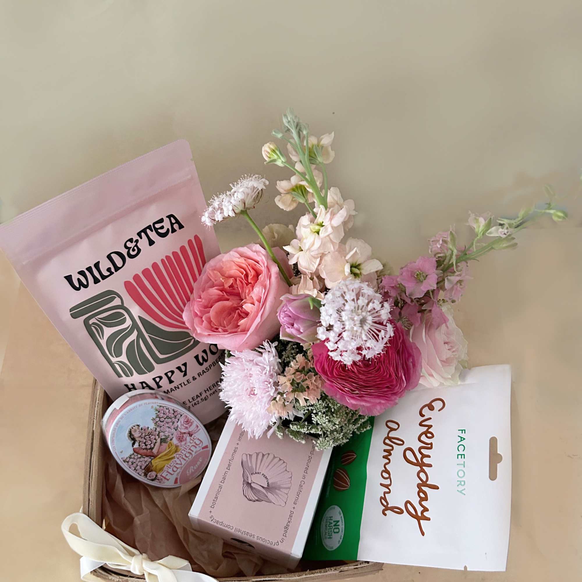 A wellness basket in the pretty colors of pink, white and green, photo 2 of 3