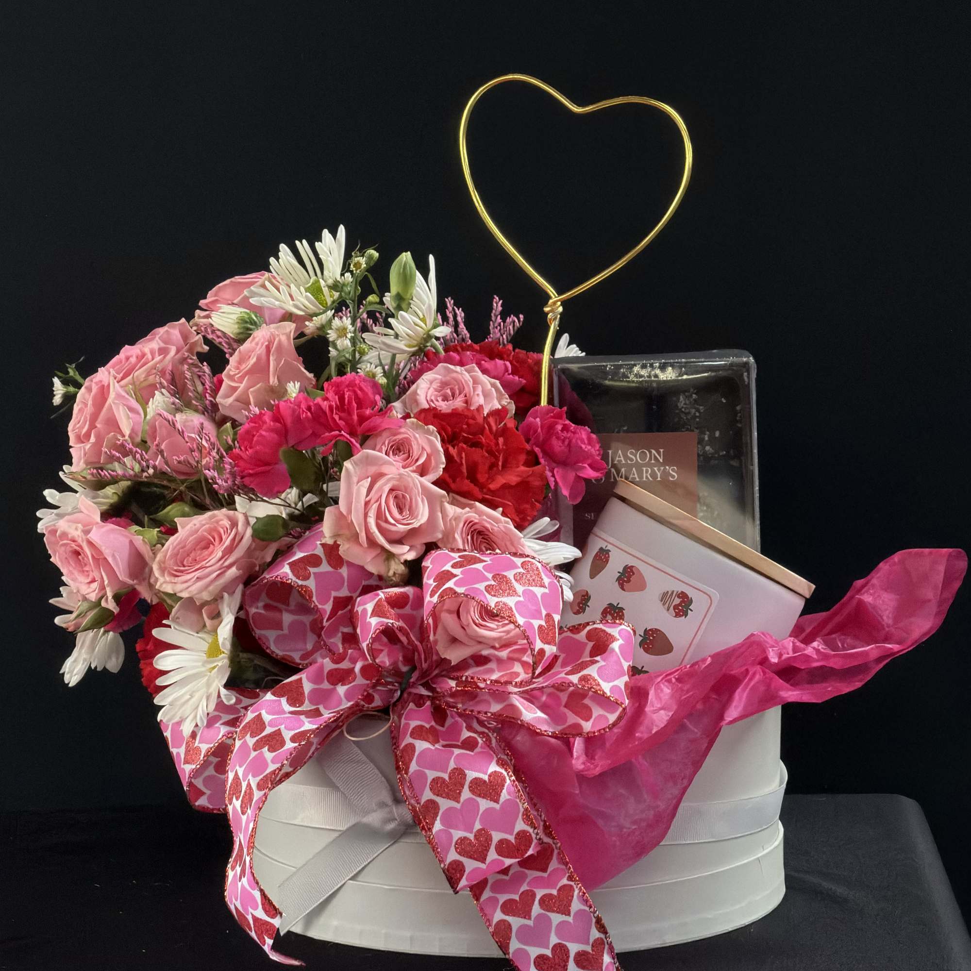 Pink rose bouquet in a white gift box with a heart topper and ribbon