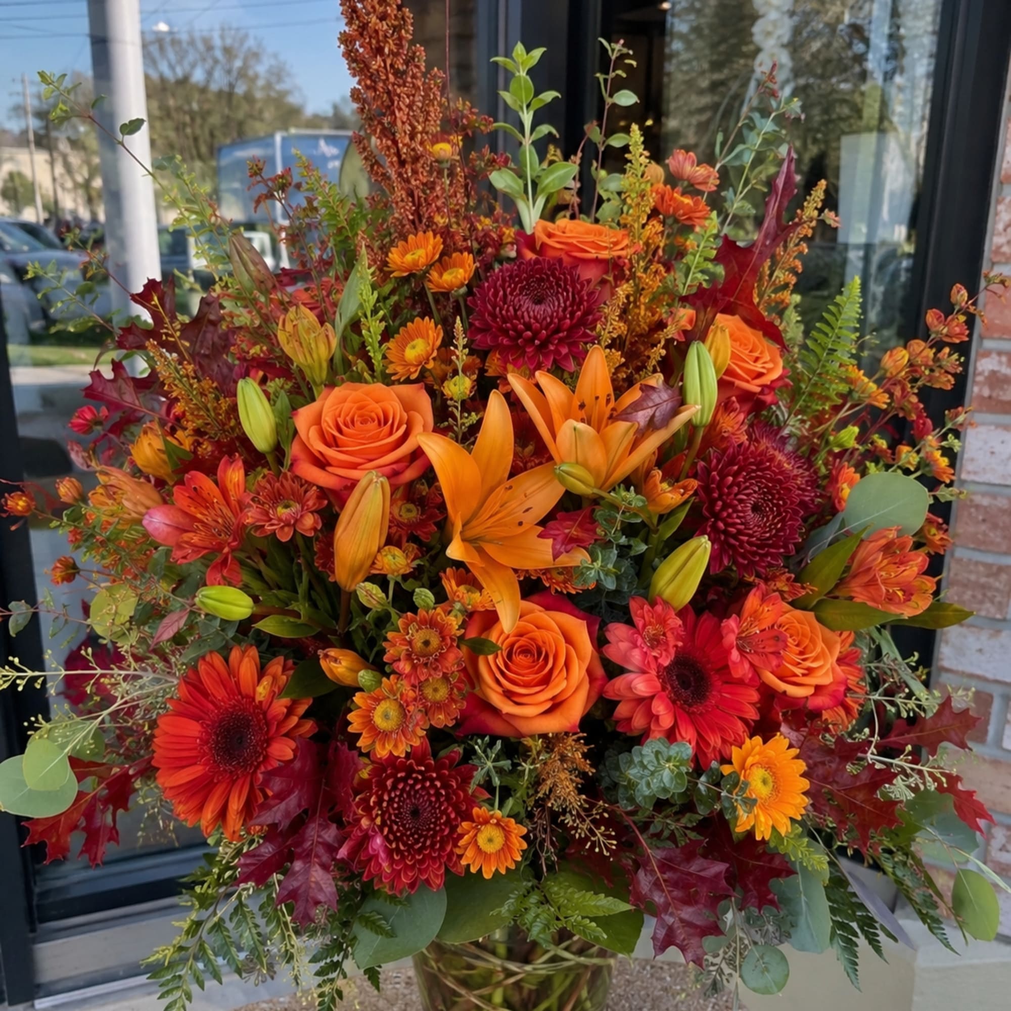 A dramatic autumn centerpiece, this large fall flower arrangement is a bold
