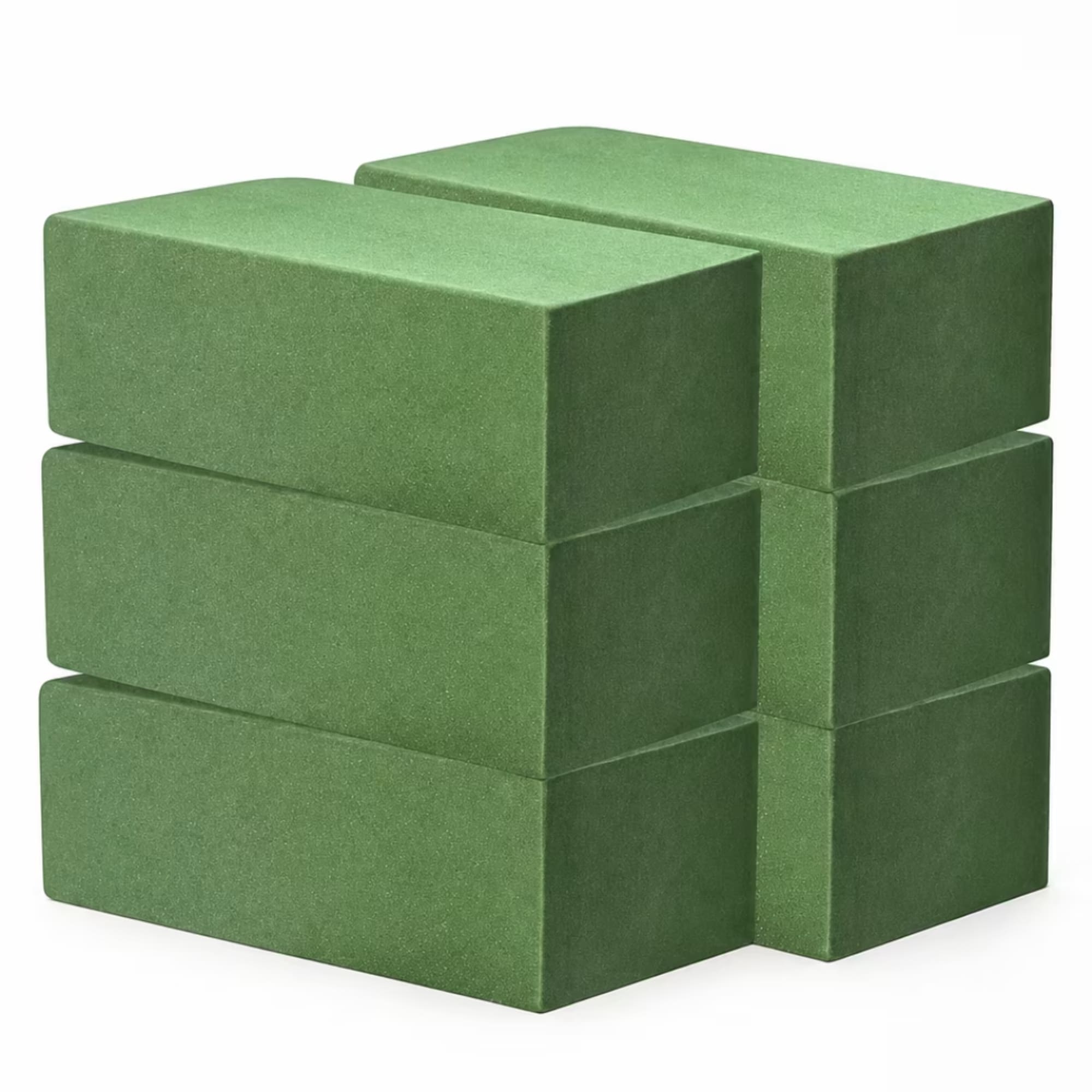 Stacked green floral foam blocks on a white background