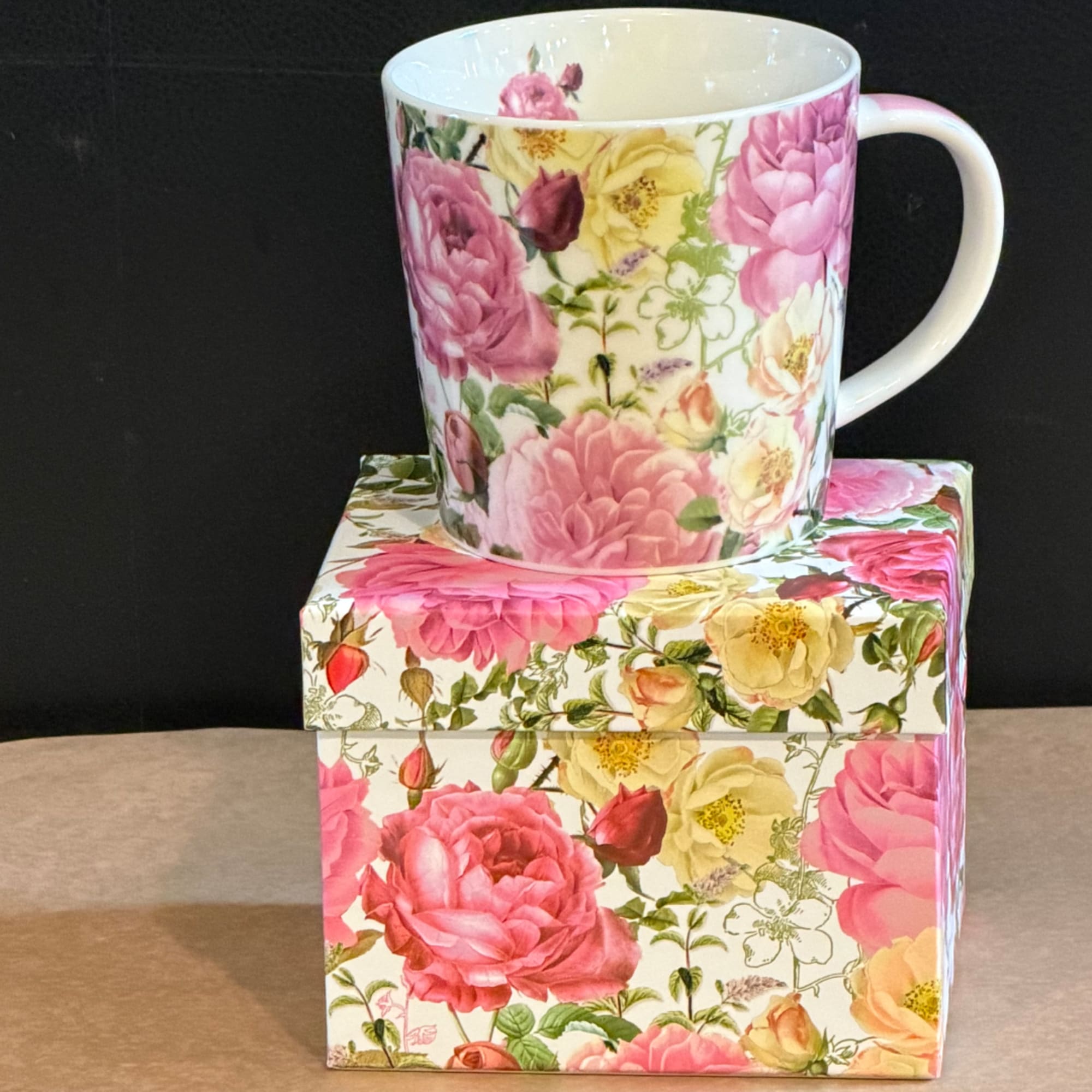 Floral-print mug sitting on a matching floral gift box