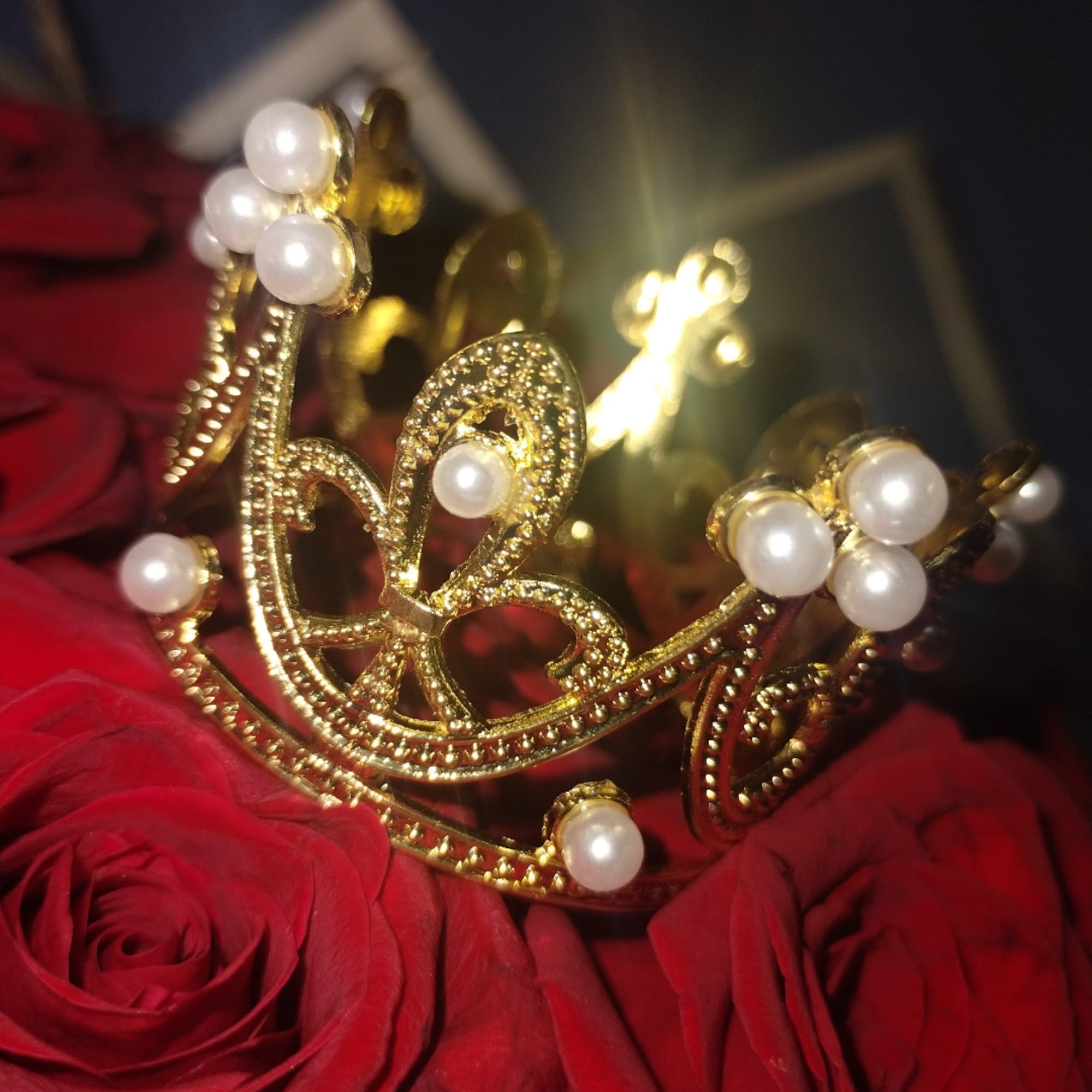 Red roses with a gold pearl tiara centerpiece