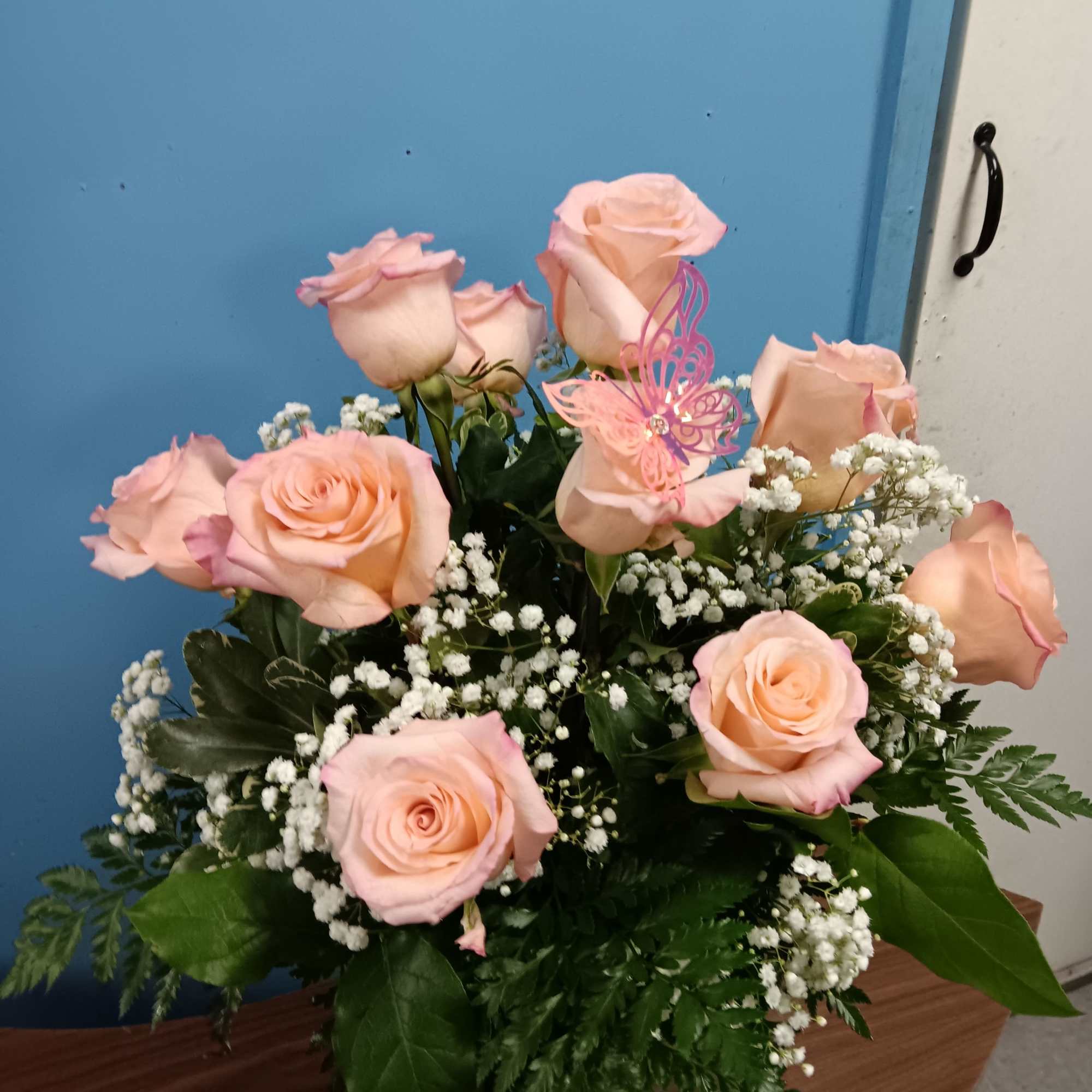 Soft peach-pink roses gathered in a rounded, upright bouquet create a tender, photo 3 of 3