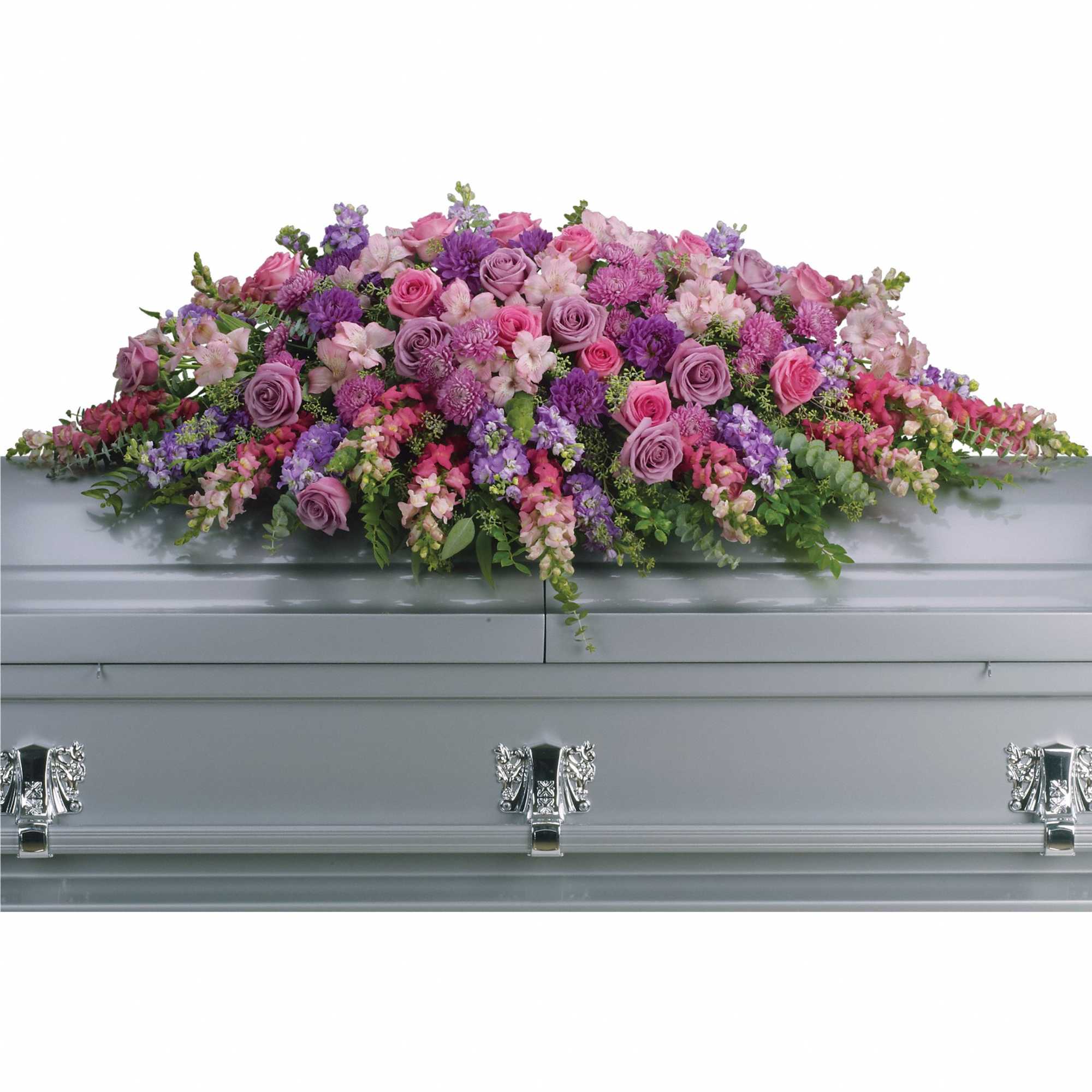 Full casket spray of pink and purple flowers on a gray casket