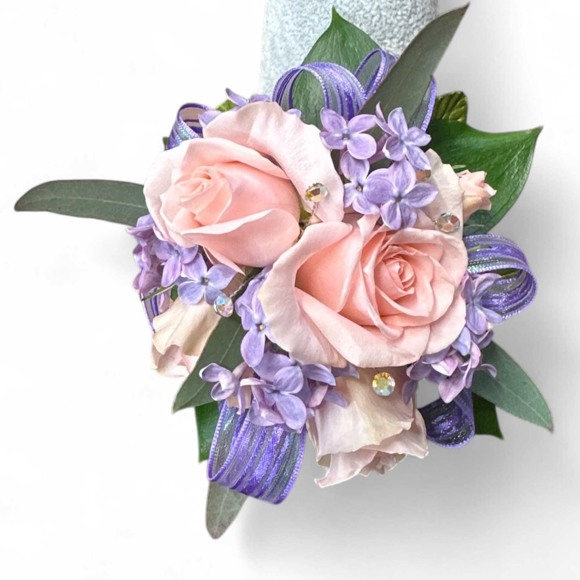 Pink rose corsage with lavender flowers and purple ribbon