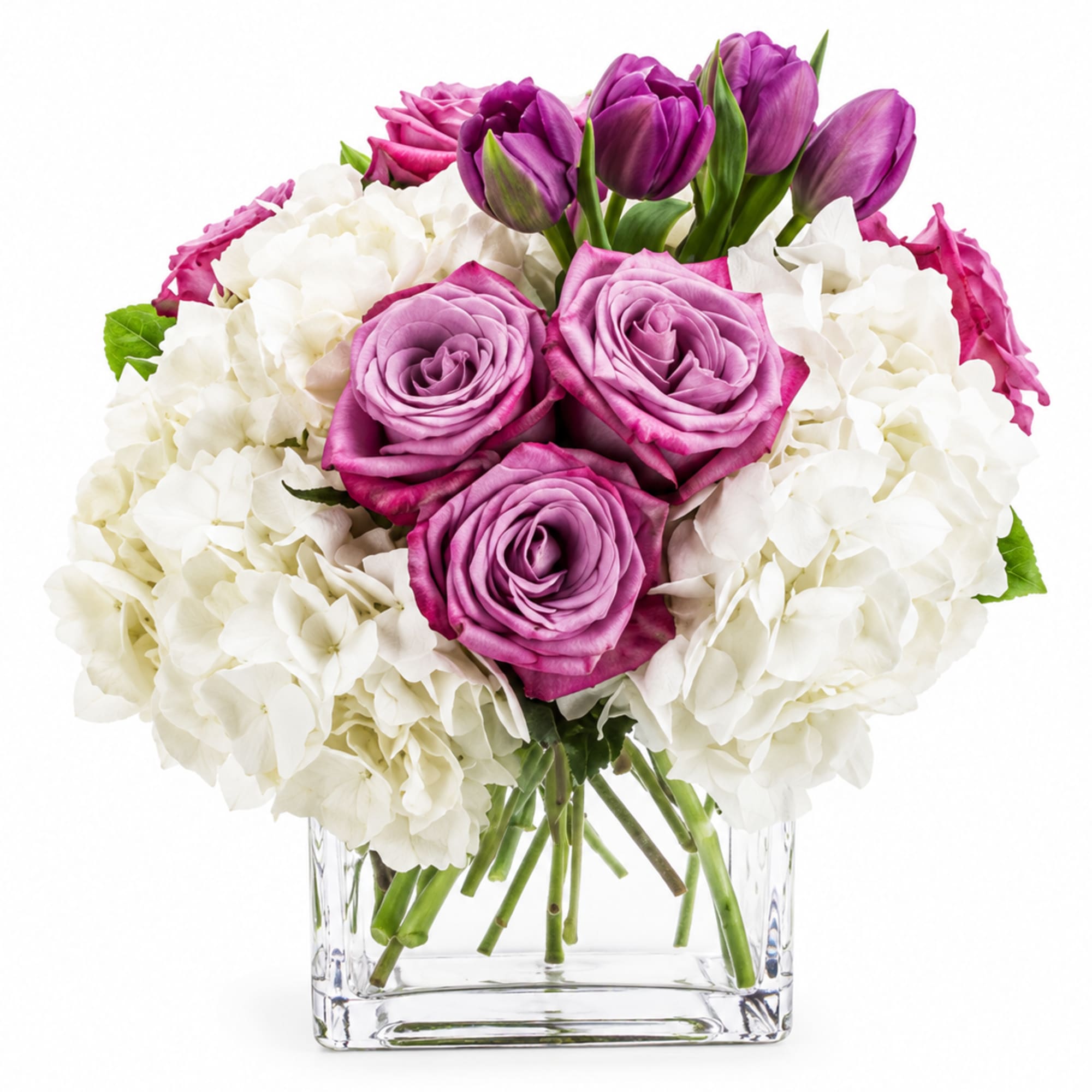 Soft, full clusters of white hydrangea cradle a heart of lavender-pink roses