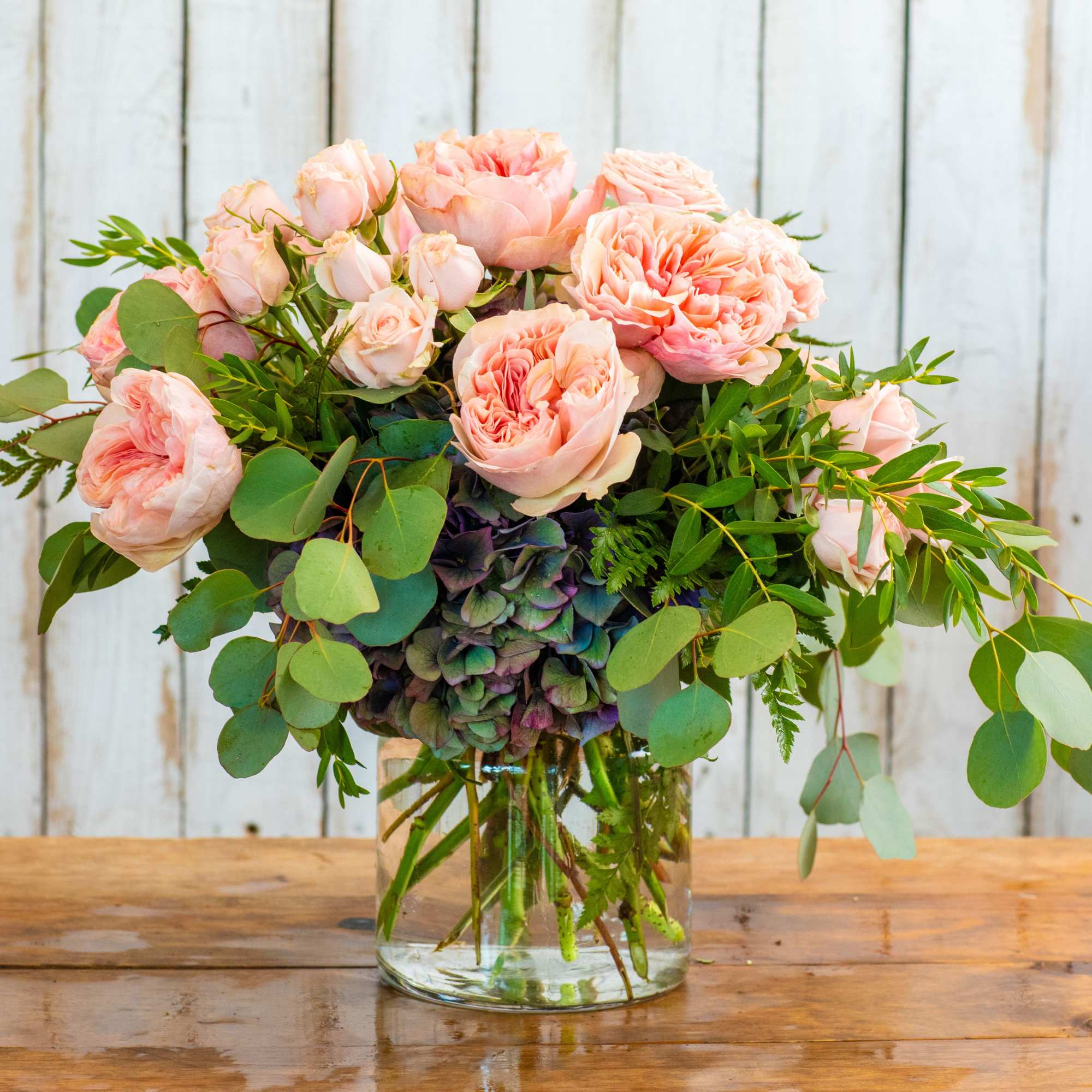 Indulge in pure romance with the Peach Garden Rose Dream, a luxurious