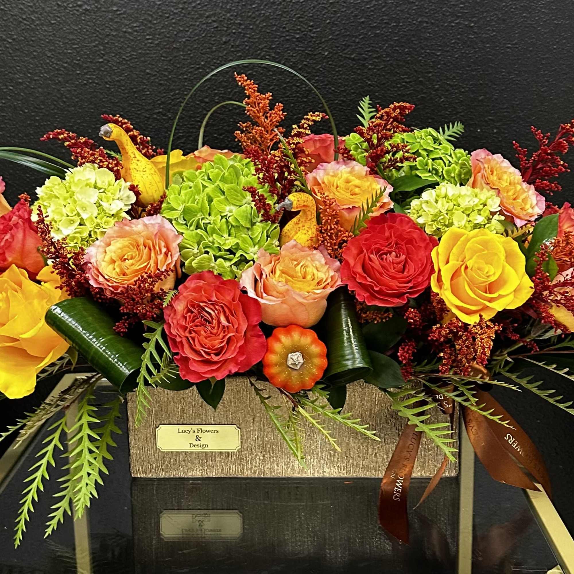 Bright mixed bouquet of roses and hydrangeas in a rectangular box