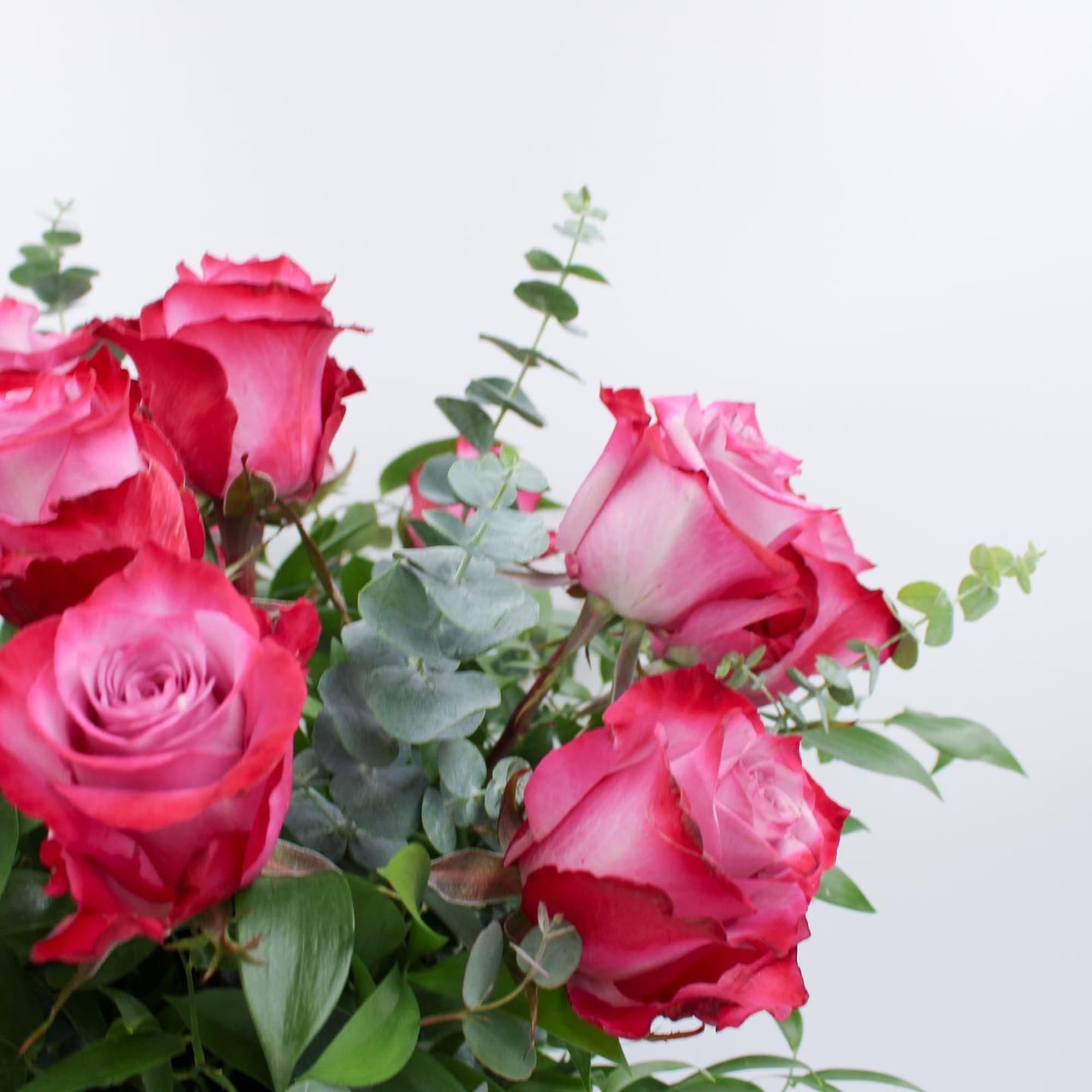 Pink roses with eucalyptus in a bouquet