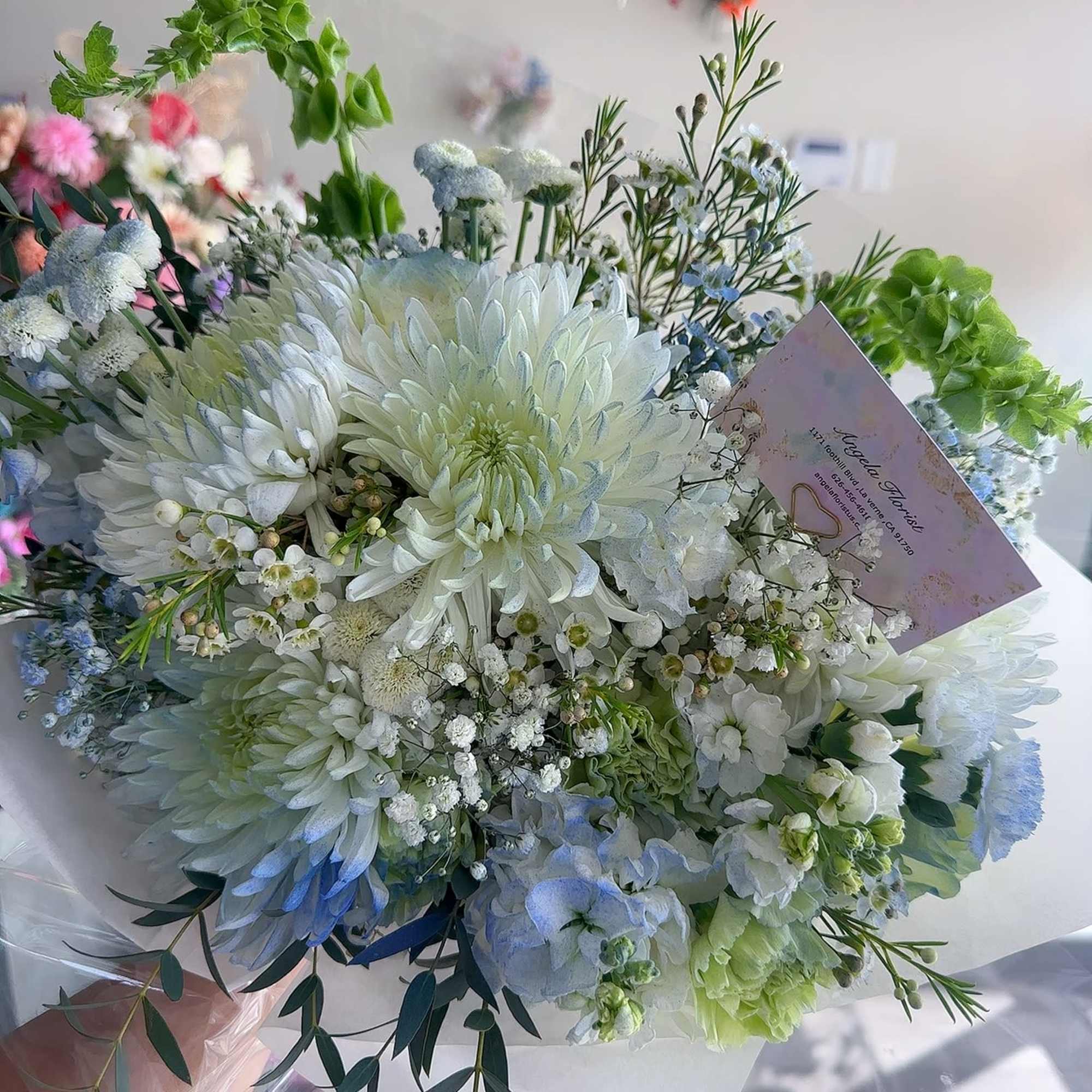 White and pale blue bouquet with chrysanthemums and small filler flowers