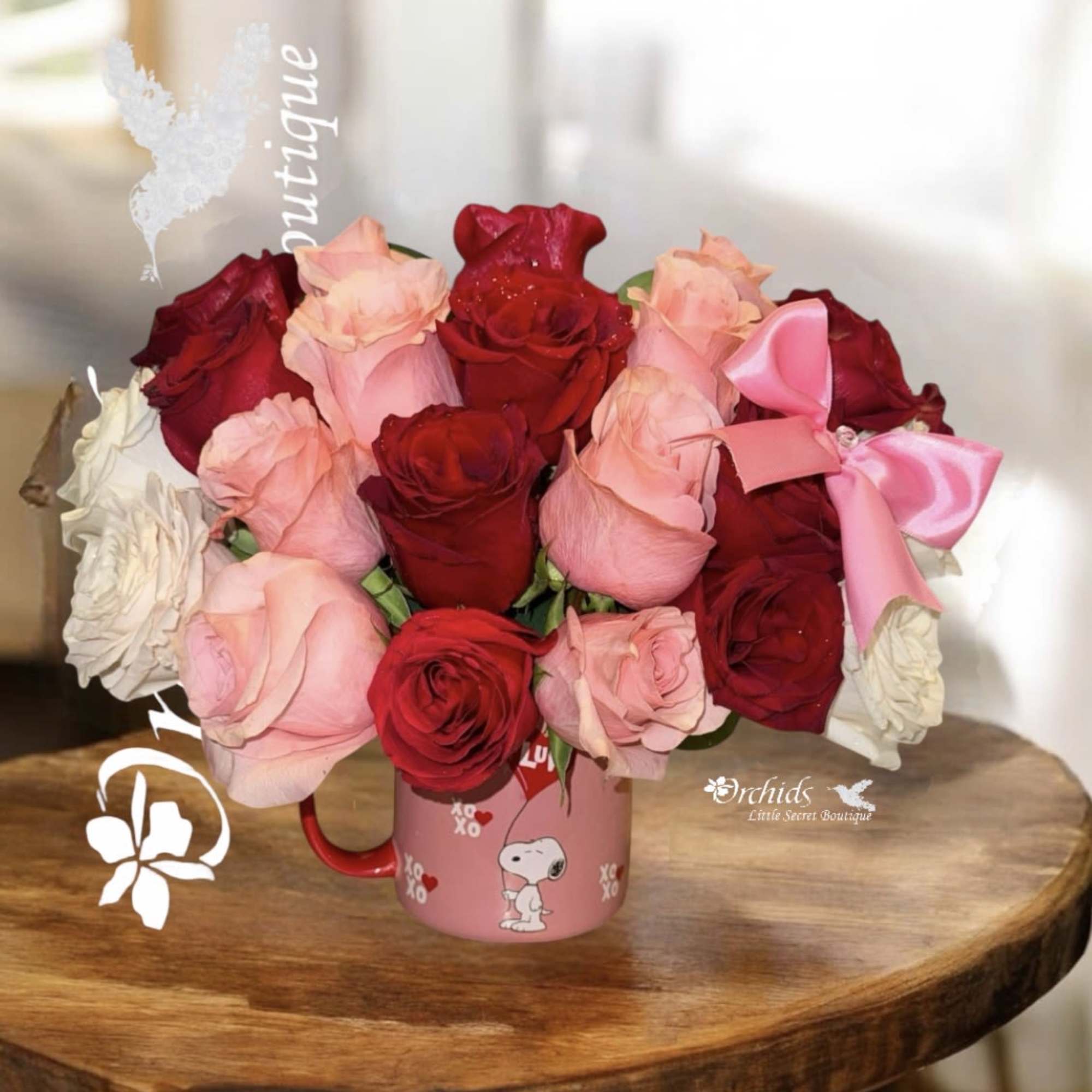 Bouquet of red and pink roses in a pink Snoopy mug