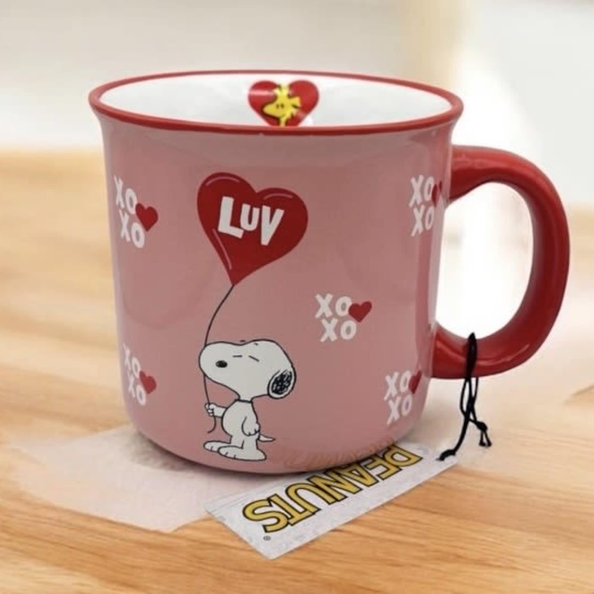 Pink mug with Snoopy holding a heart balloon