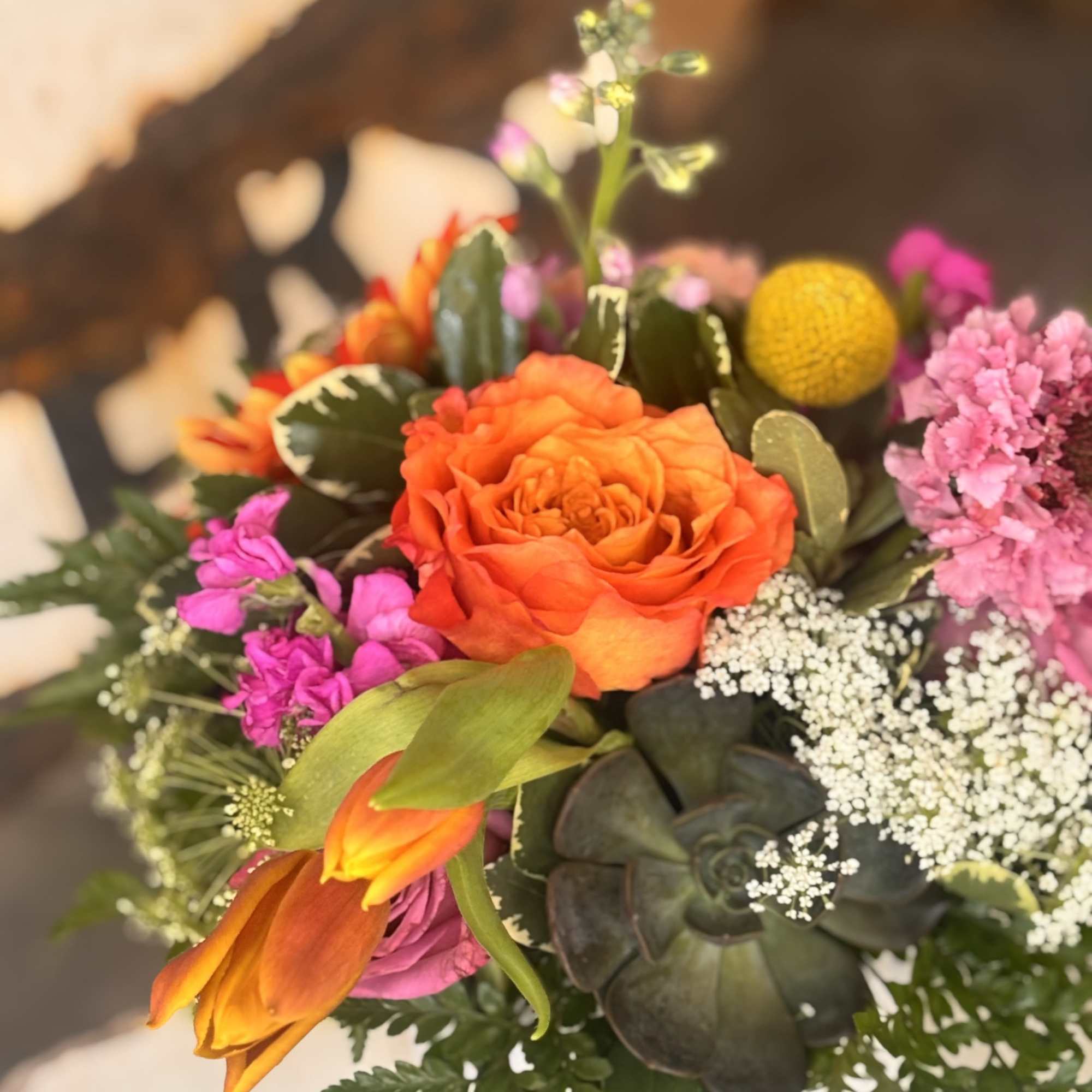 A vivid orange gerbera takes center stage in this cheerful mixed bouquet, photo 2 of 2